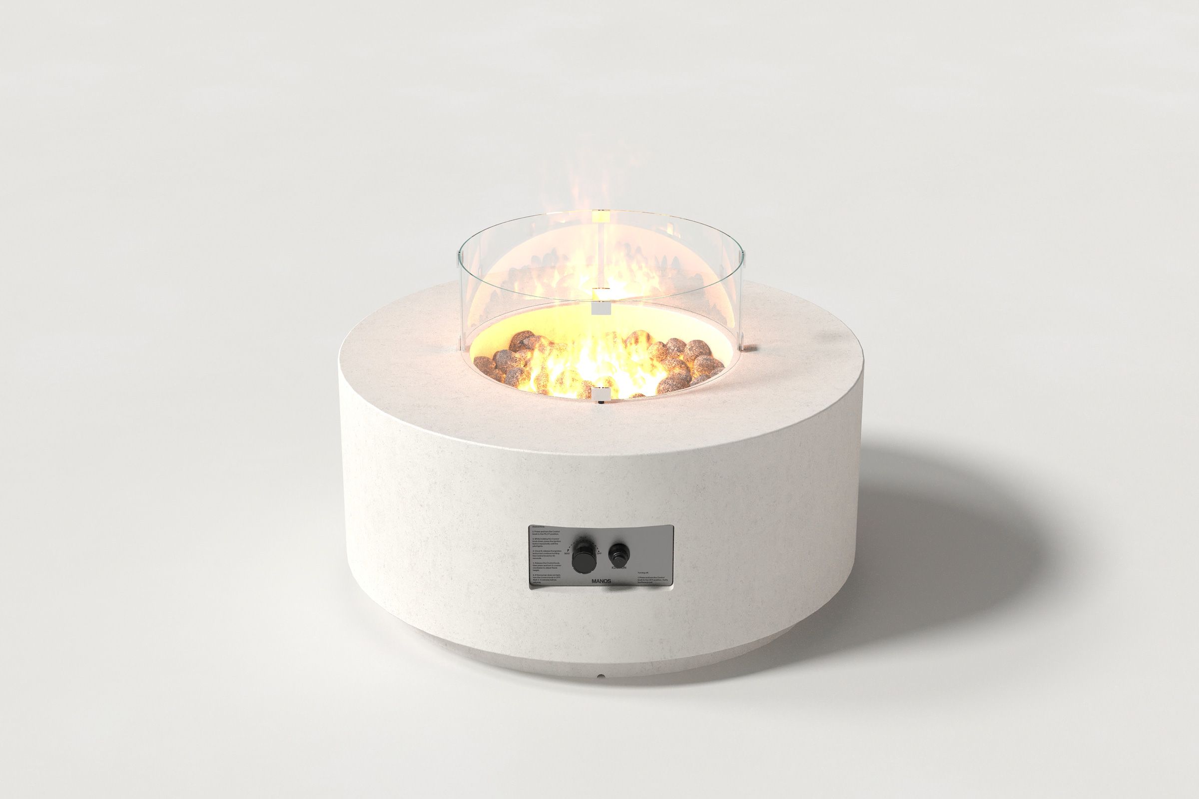 Low cylindrical white colored concrete fire pit with thick walls and a central circular well filled with dark volcanic rocks and flame, featuring an integrated control panel, with a glass shield. Front view on a white background.
