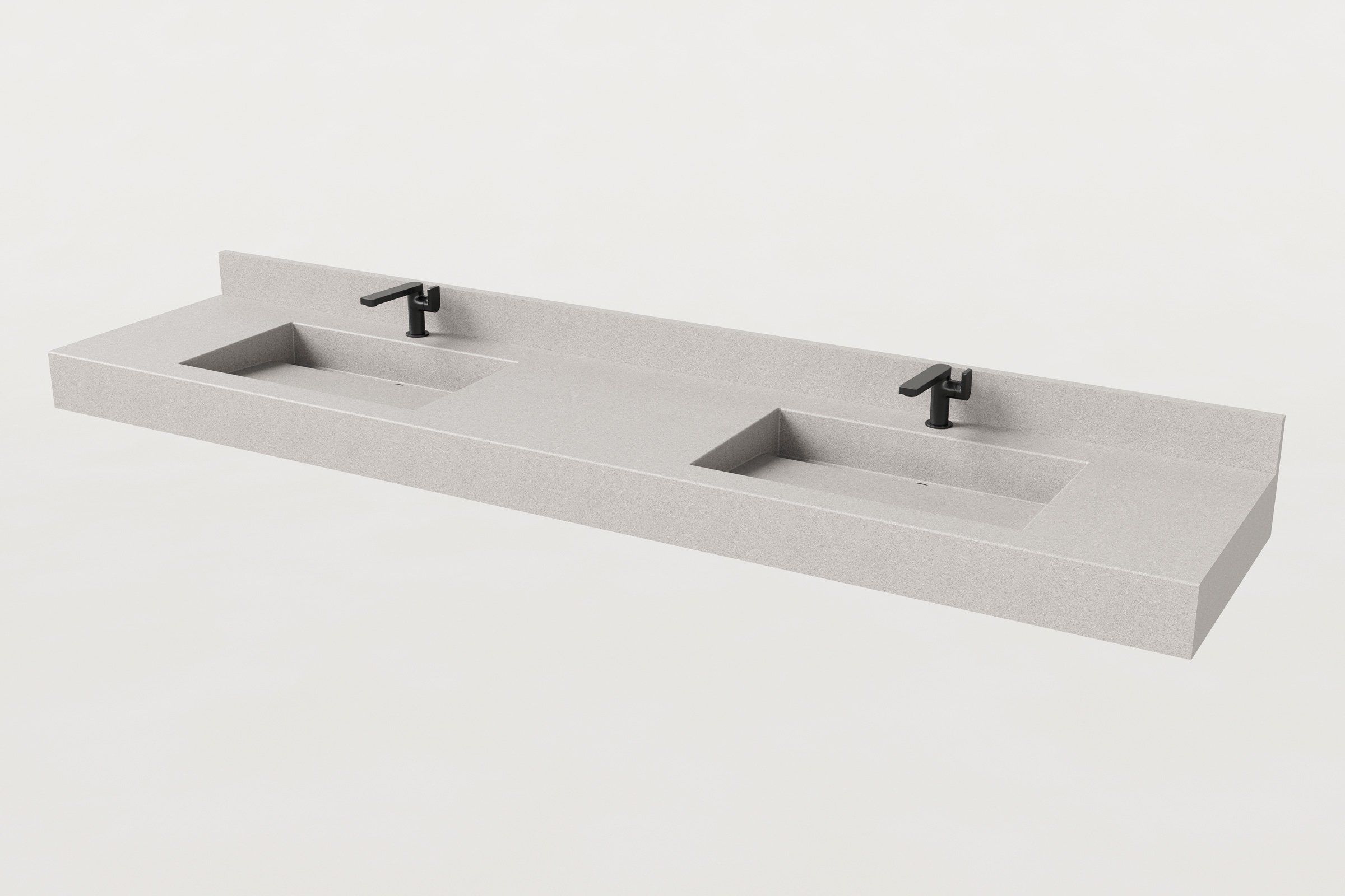 Double-basin concrete sink in fog finish with backsplash and two matte black faucets installed.