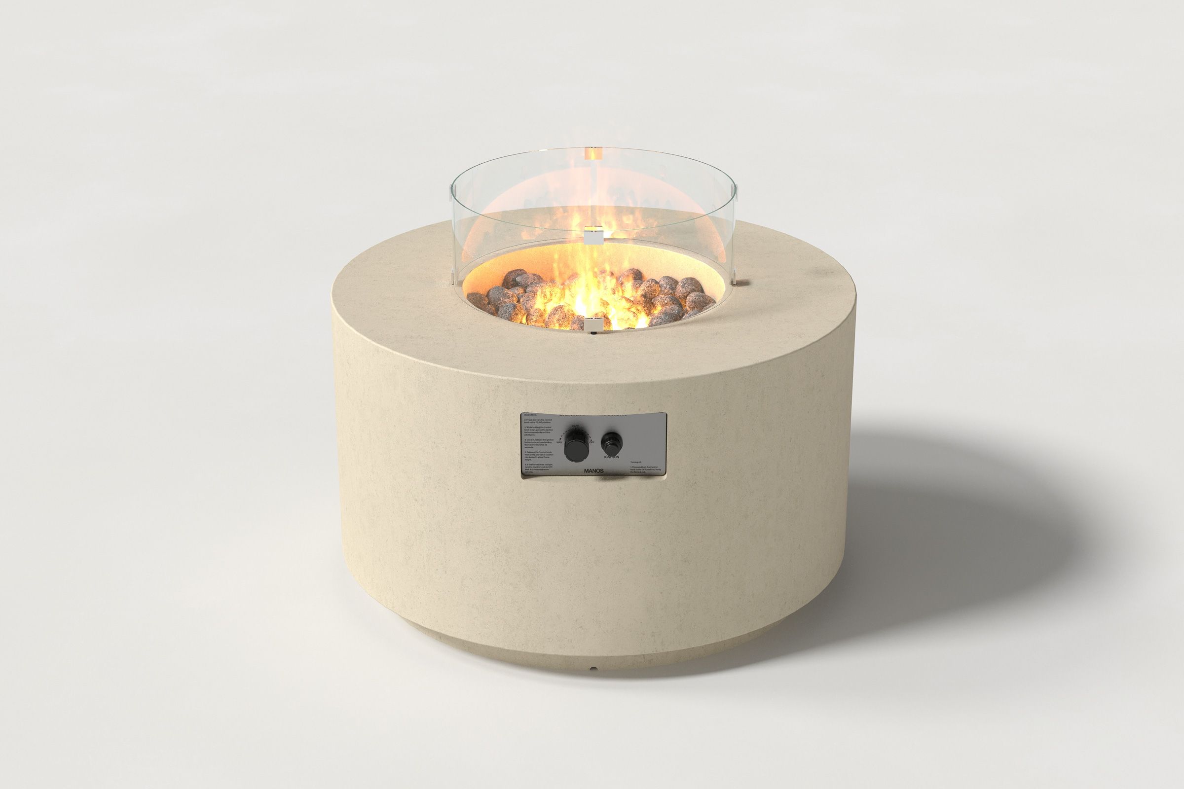 Low cylindrical sand colored concrete fire pit with thick walls and a central circular well filled with dark volcanic rocks and flame, featuring an integrated control panel and glass shield. Front view on a white background.