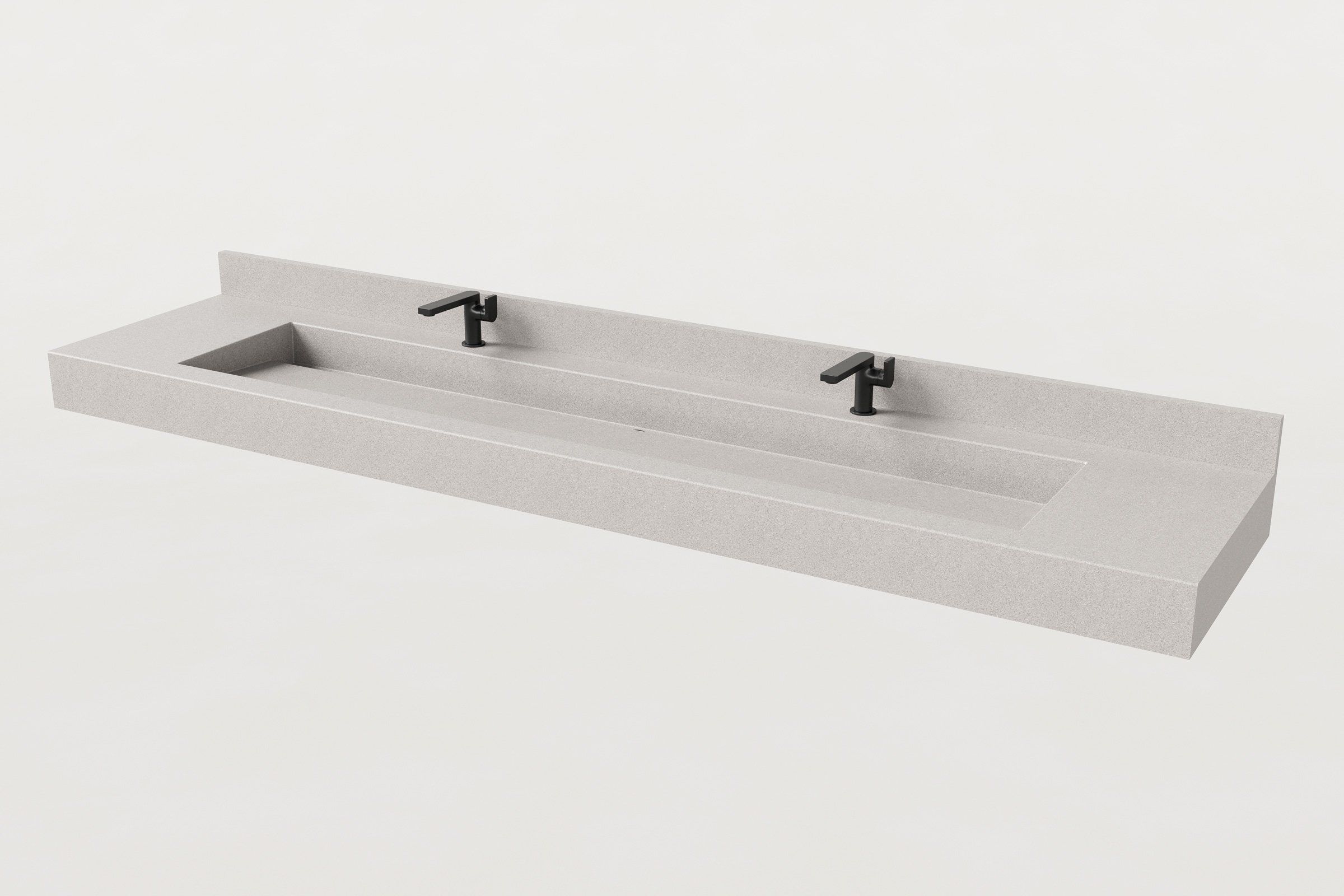 Rectangular concrete trough sink in fog finish with backsplash and two matte black faucets installed.