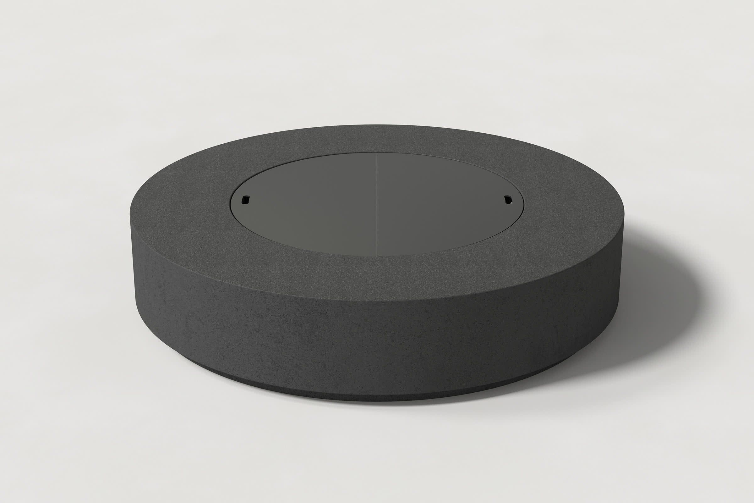 Low cylindrical charcoal concrete fire pit with thick walls and a central circular well. Mid-range angle shows the well covered with matching cover with handles against a white background.