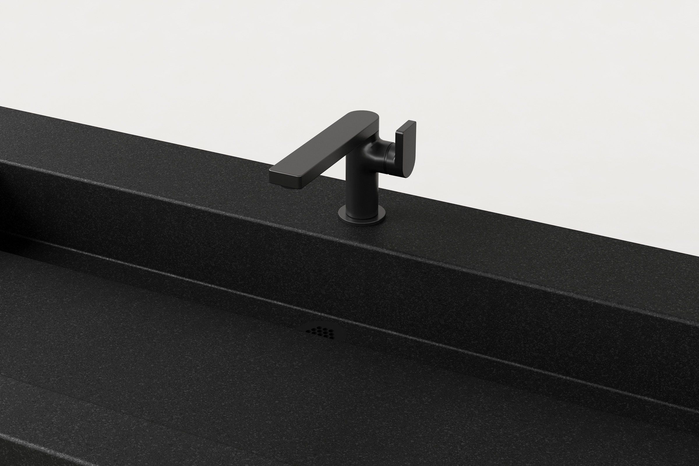 Detail view of Trof Drop 60 Storm basin surface and faucet placement.
