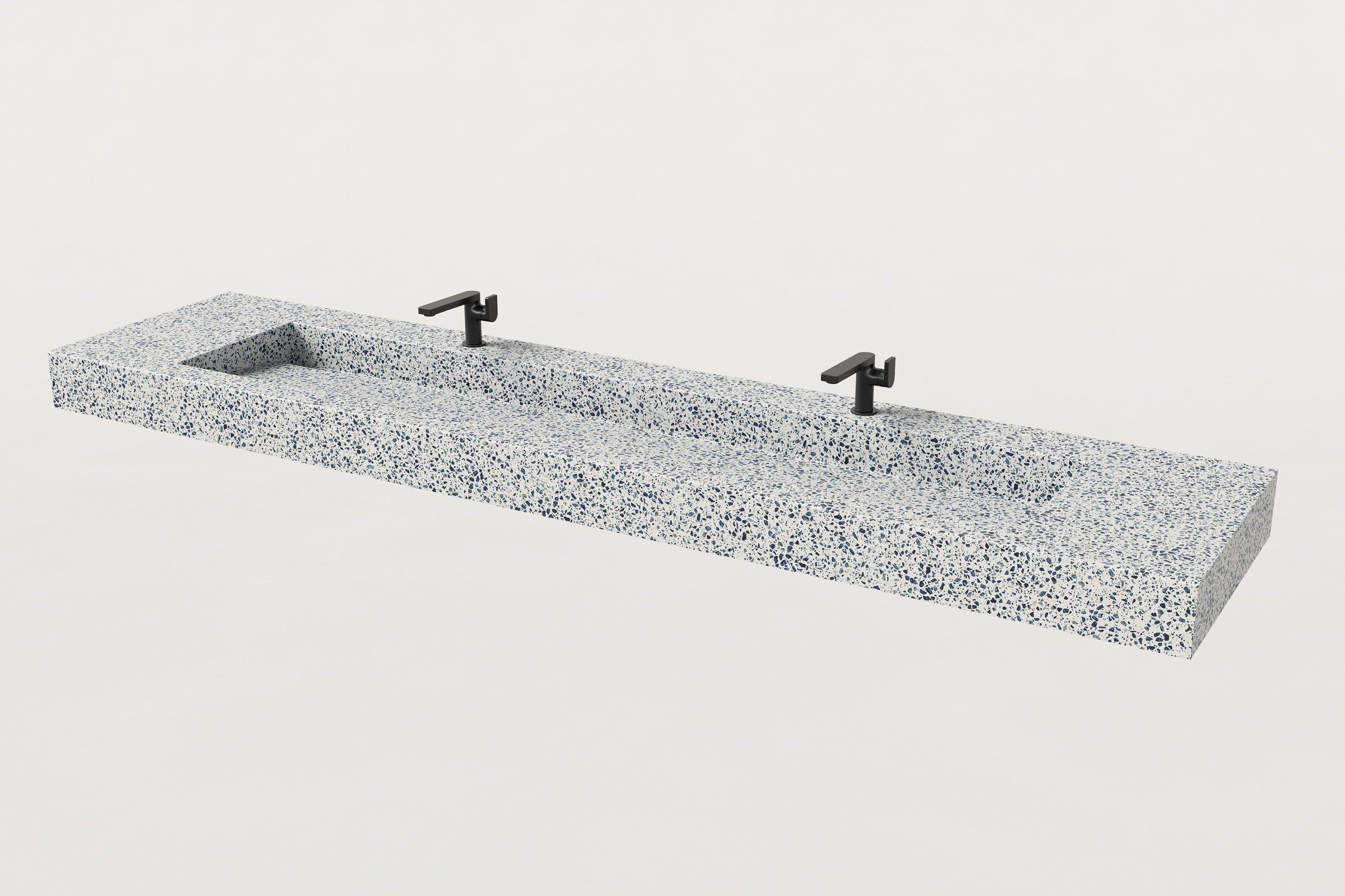 Terrazzo single-basin sink with two matte black faucets installed above basin.