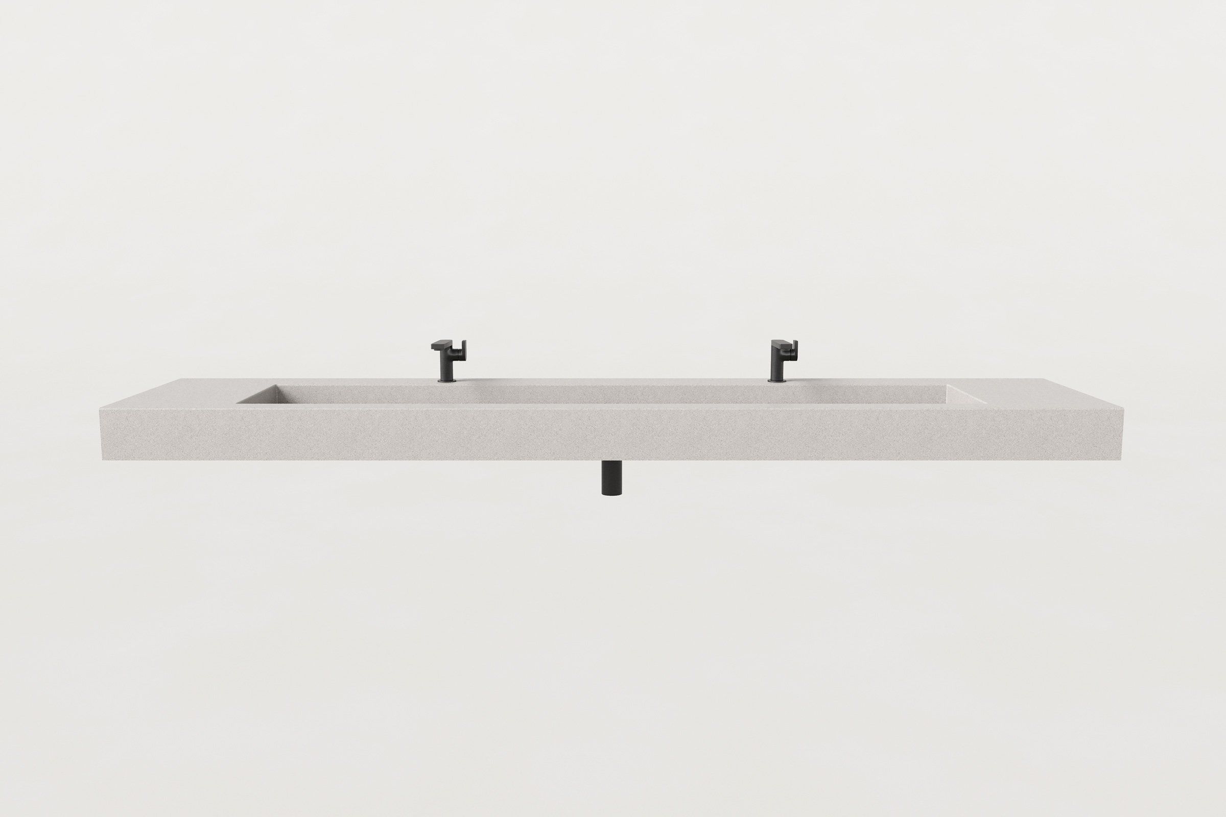 Front view of fog finish concrete trough sink with two matte black faucets.
