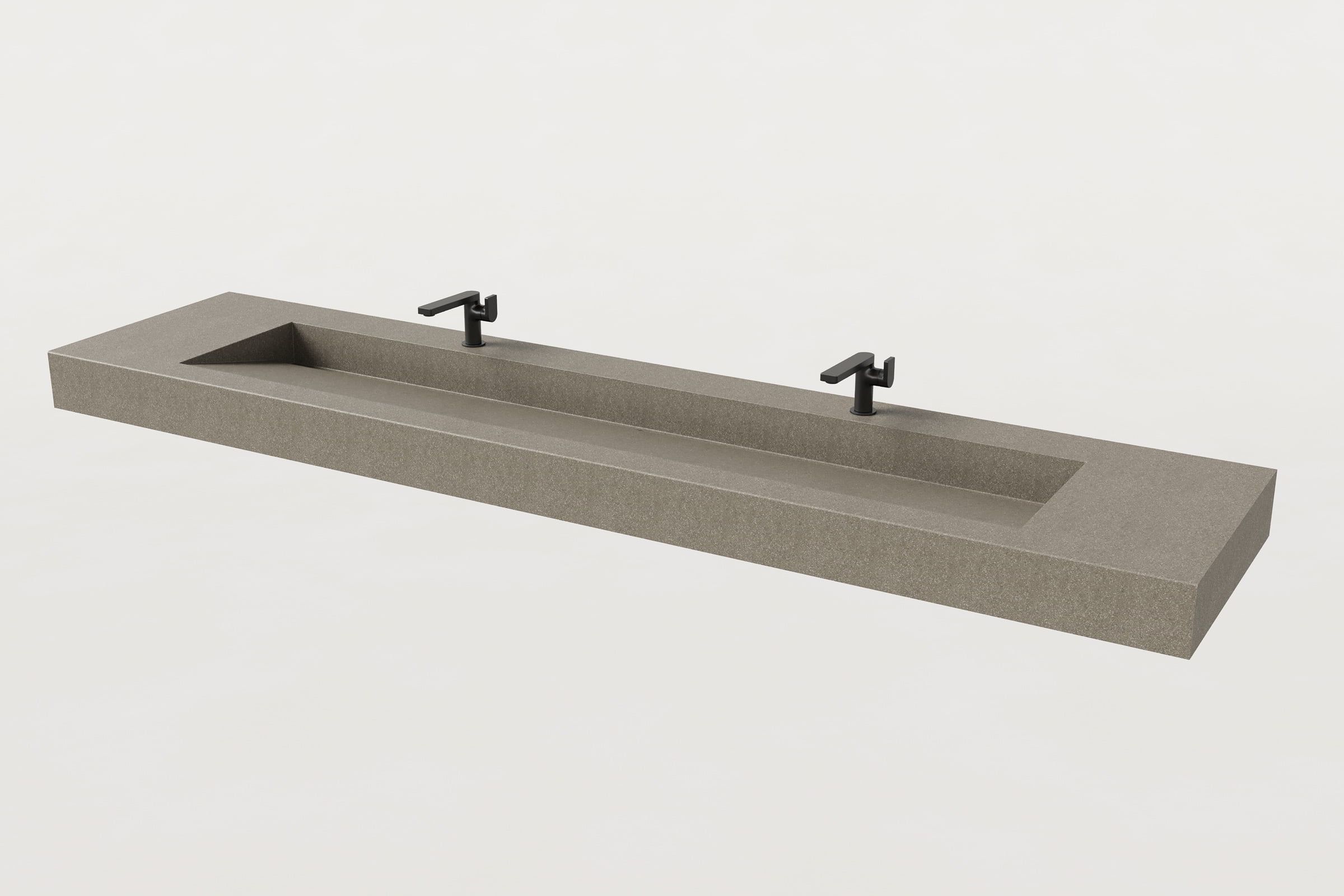 Beige Trof sink with two matte black faucets.