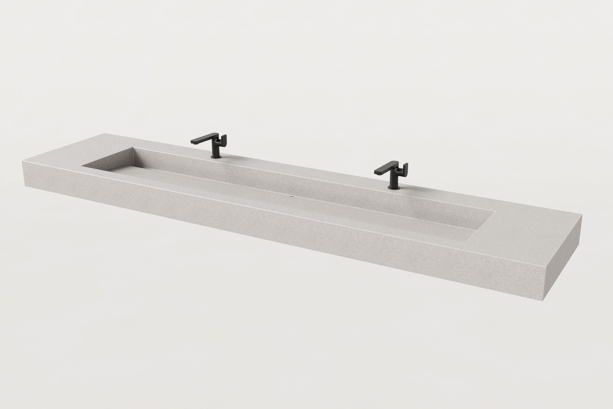 Rectangular concrete trough sink in fog finish with two matte black faucets installed.