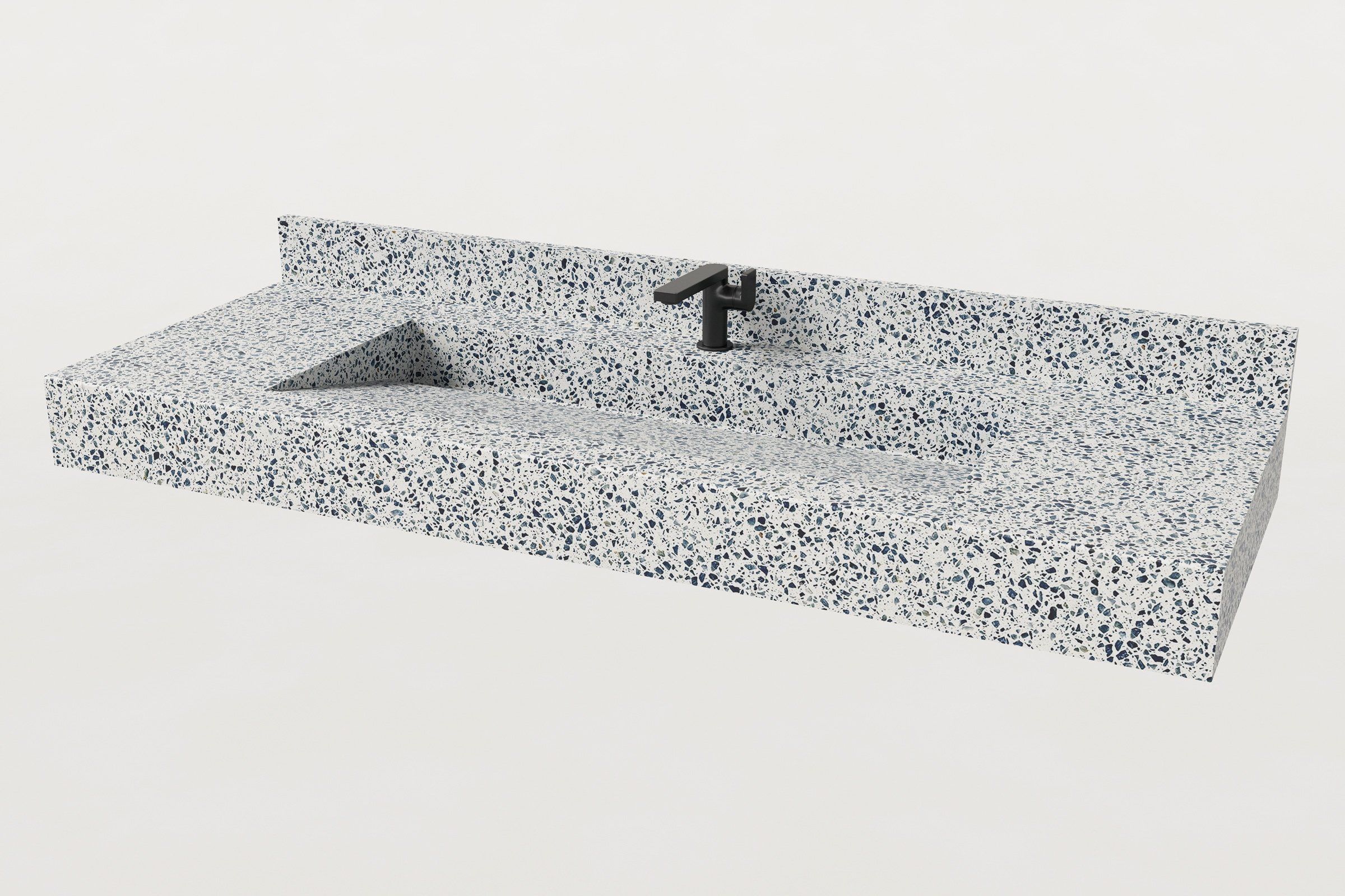 Terrazzo sink with backsplash and black faucet, viewed at an angle to highlight the basin slope.