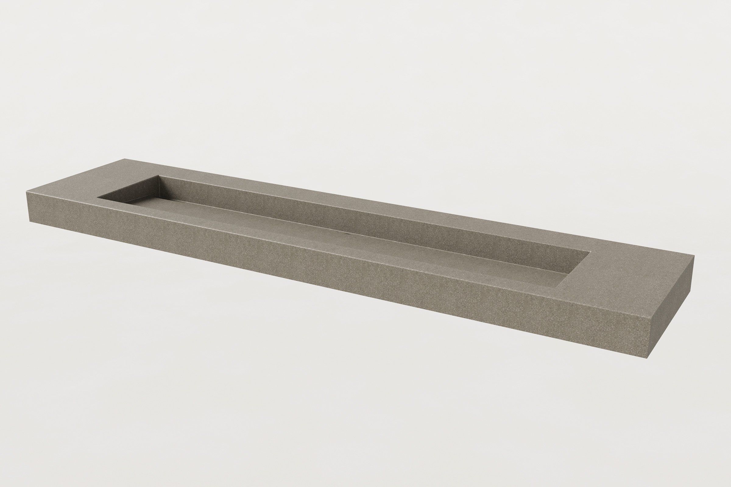 Concrete sink basin in hurricane finish with a single long trough and no fixtures installed.