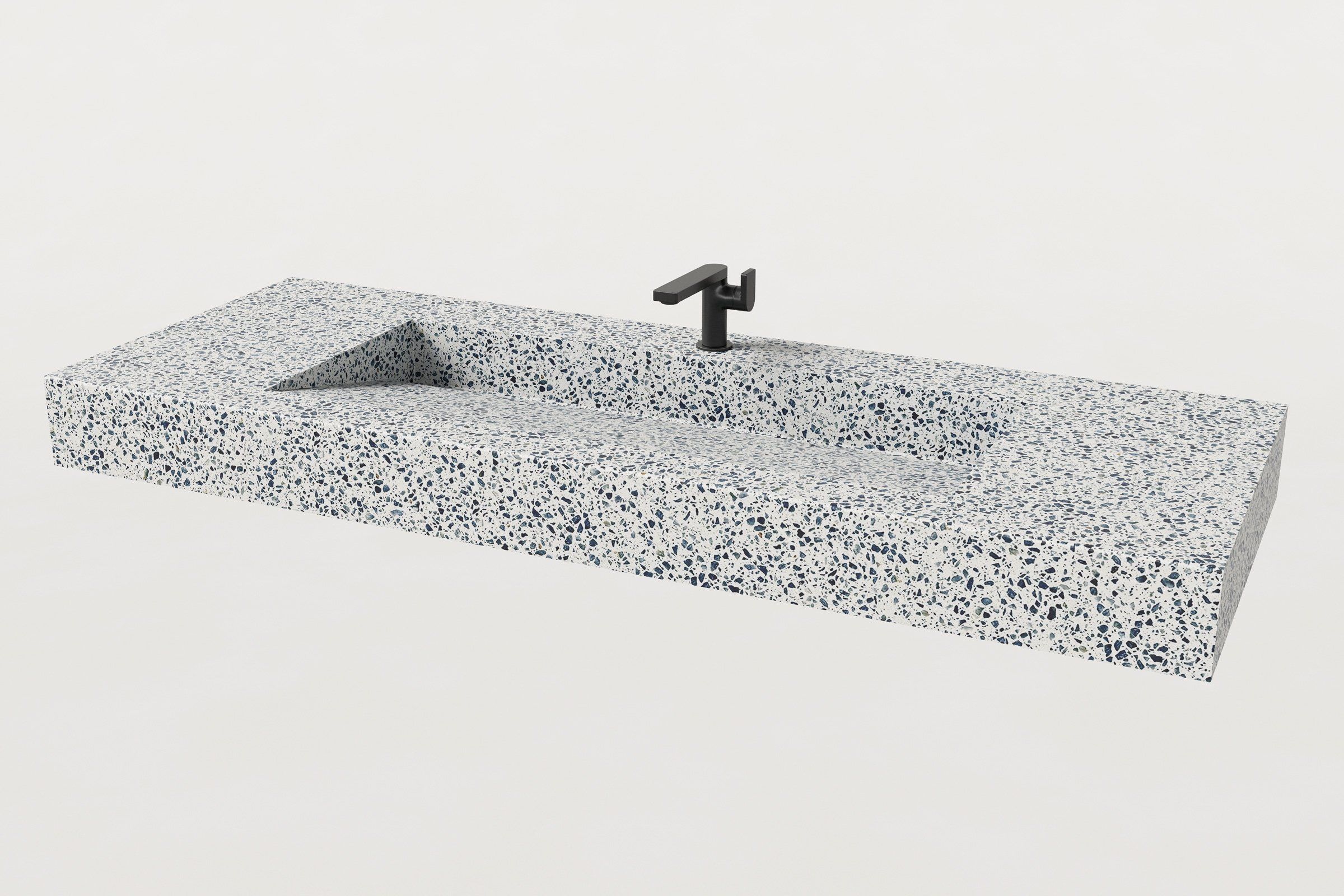 Unazzo terrazzo sink with a black matte faucet installed.