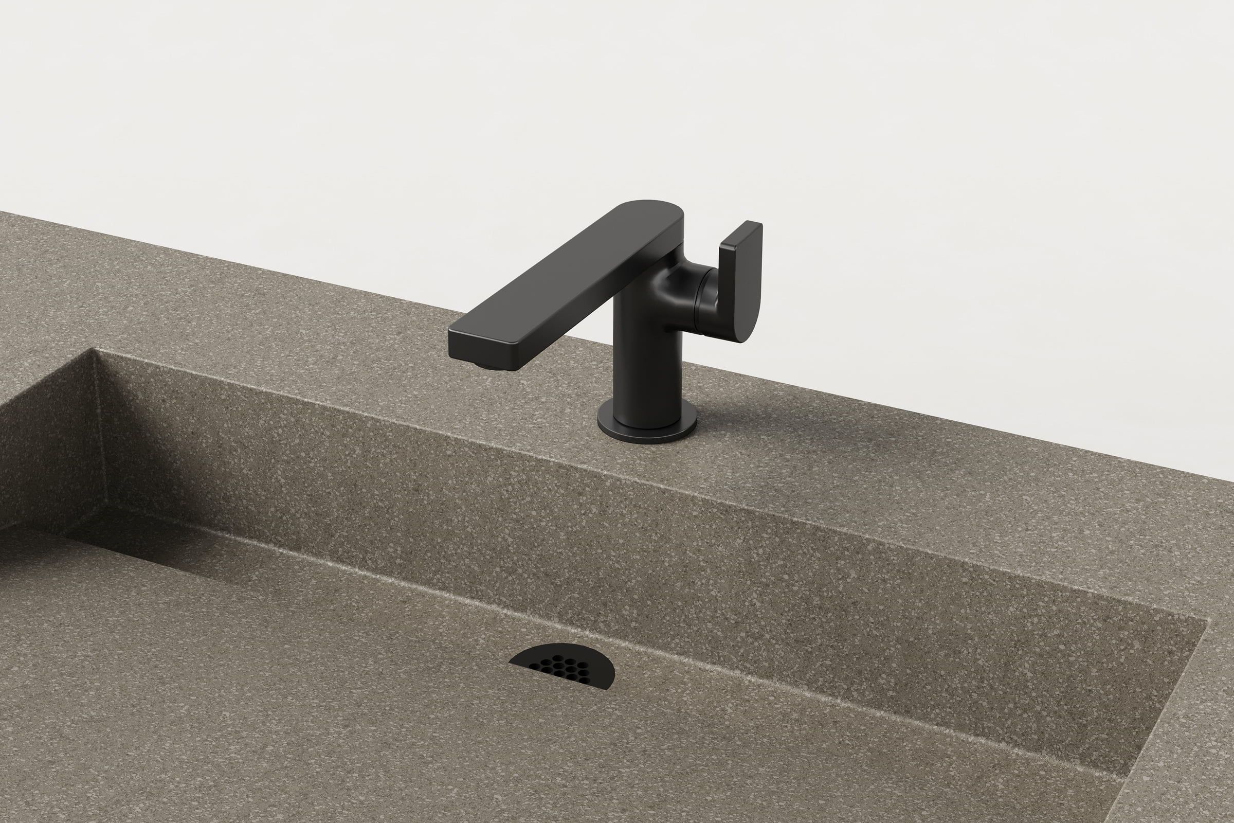 Close-up of black faucet and drain detail on Hurricane Trof sink.