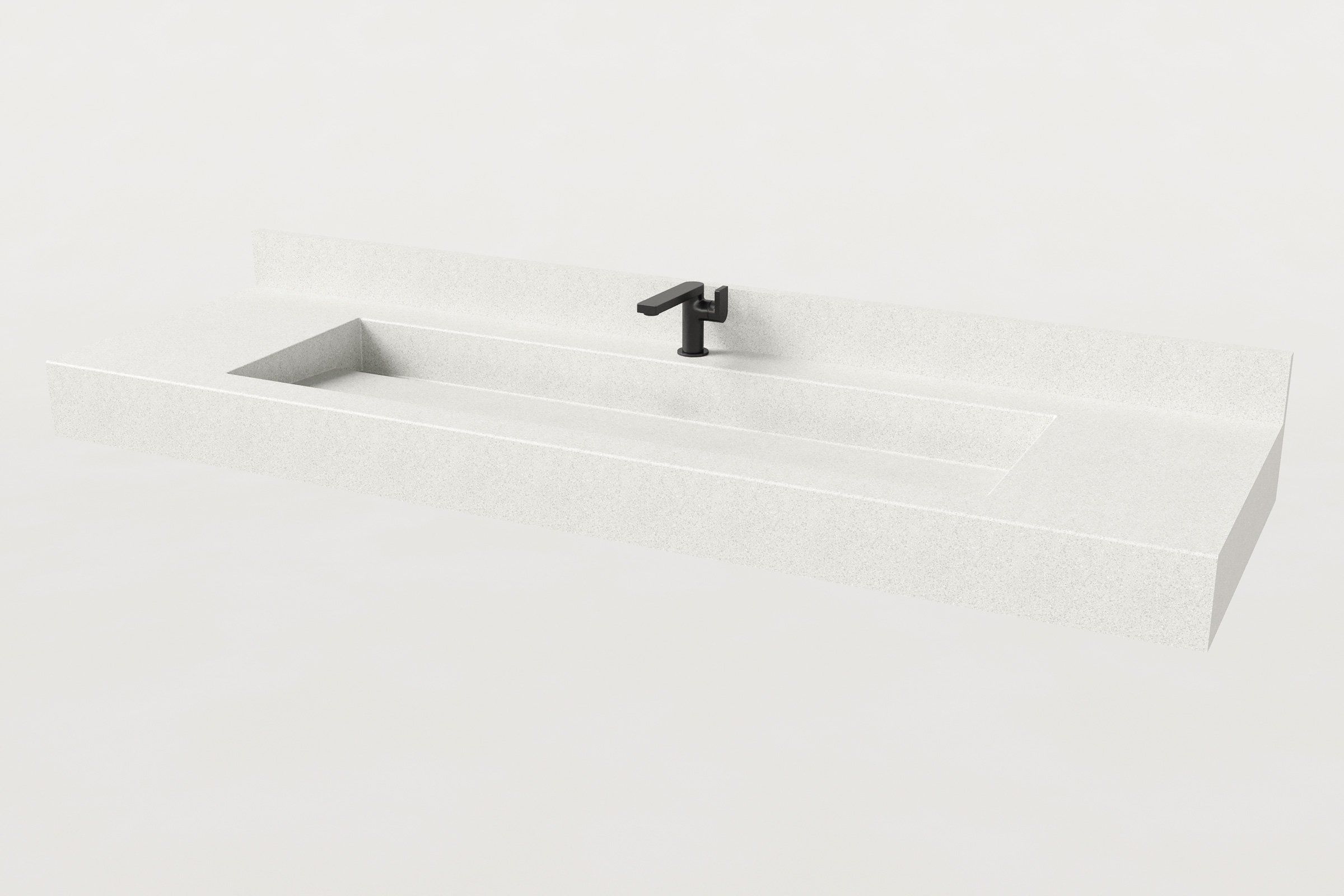 Rectangular concrete sink basin in Chalk finish with matte black faucet and low backsplash.