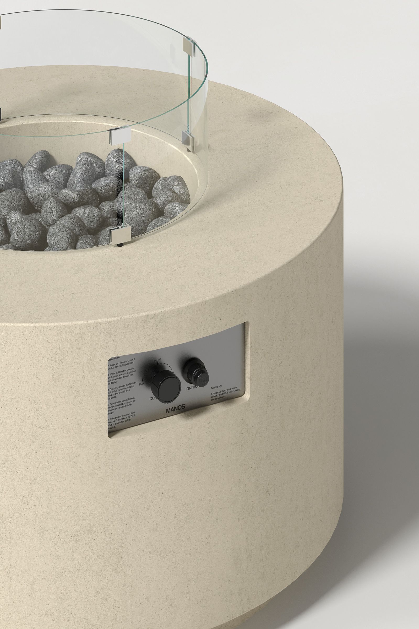 Close-up photograph of a sand-colored concrete fire pit with thick walls, showing the circular well with volcanic rocks, glass shield hardware, and integrated control panel.
