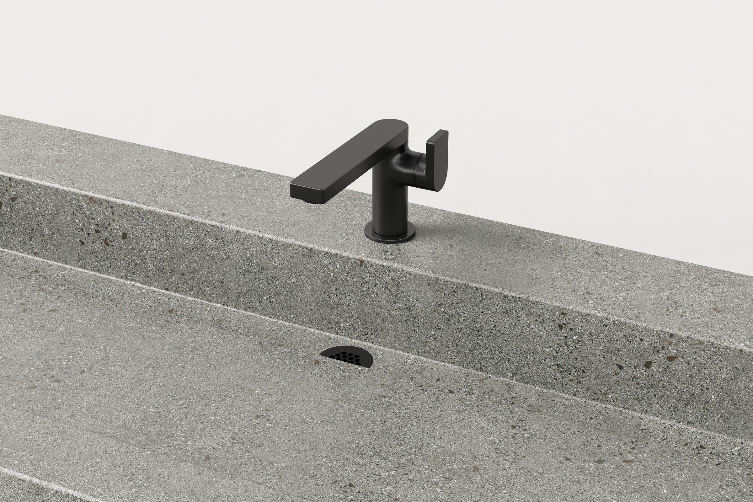 Close-up of matte black faucet and drain detail on Trof Drop 72 sink in Juda finish.