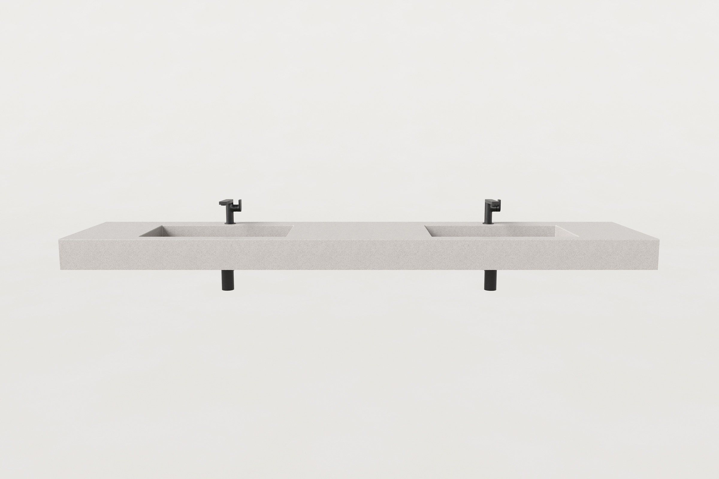 Front view of double-basin fog finish concrete sink with two matte black faucets.