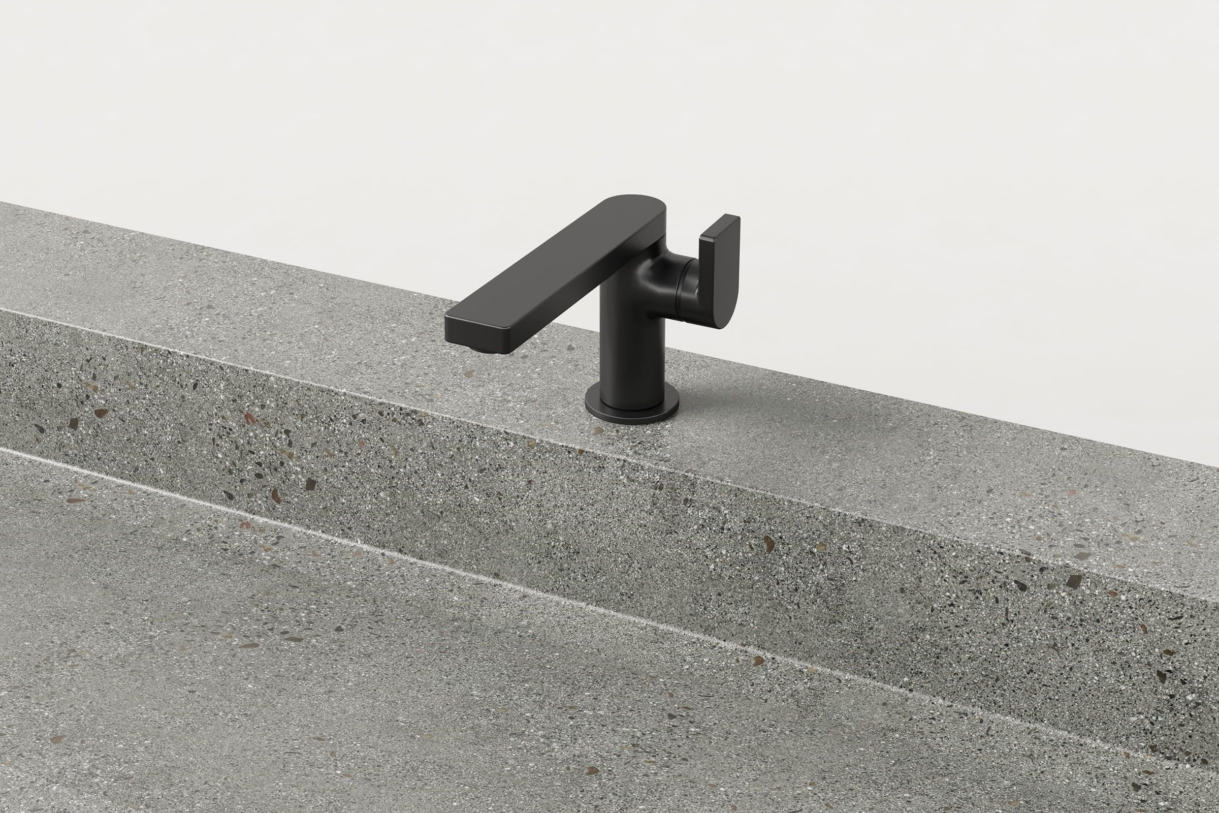 Close-up of matte black faucet on Juda Trof sink.