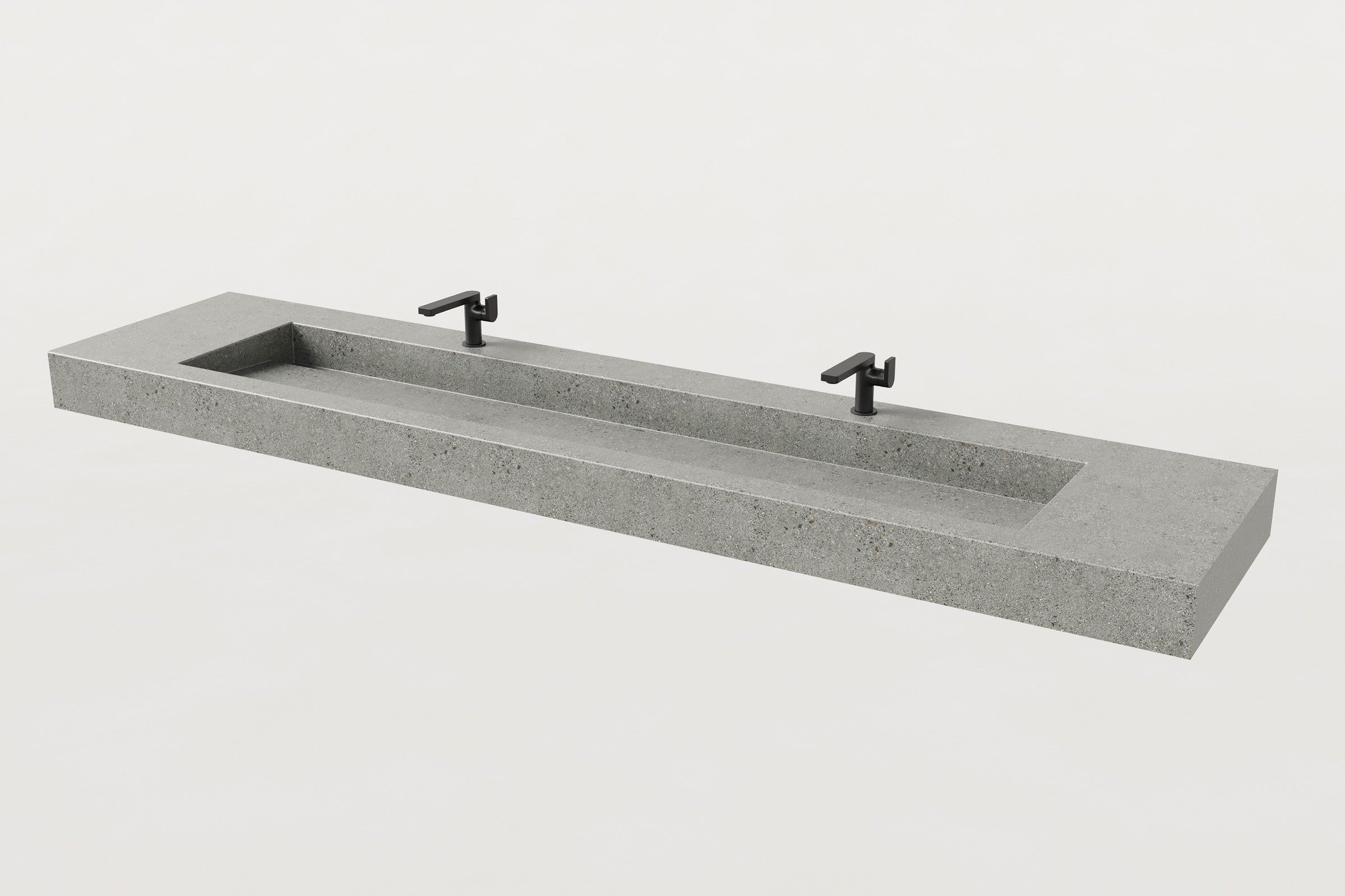 Concrete trough sink with a single long rectangular basin, fitted with two black faucets.