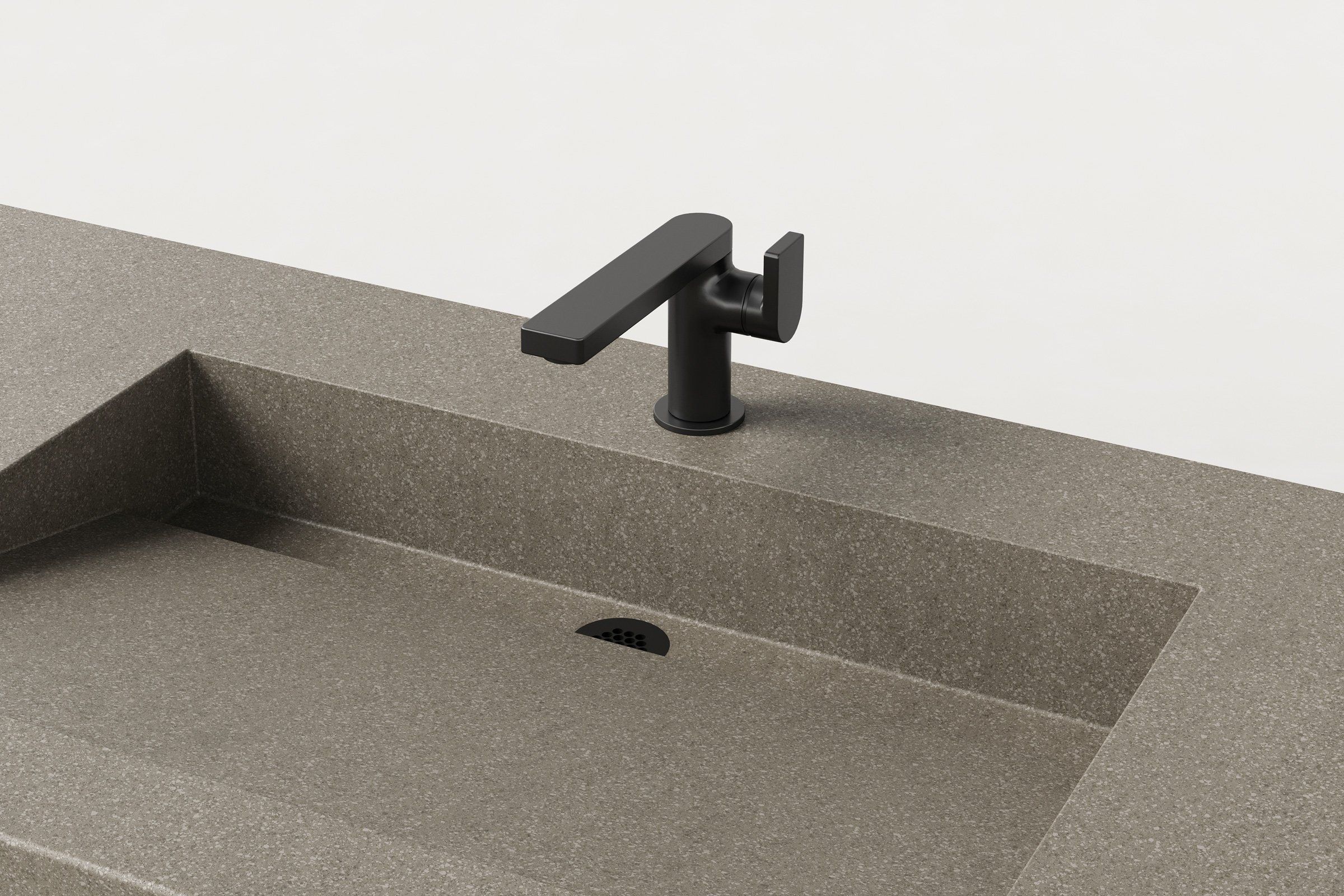 Close-up of Hurricane finish basin with matte black faucet and discreet slot drain.