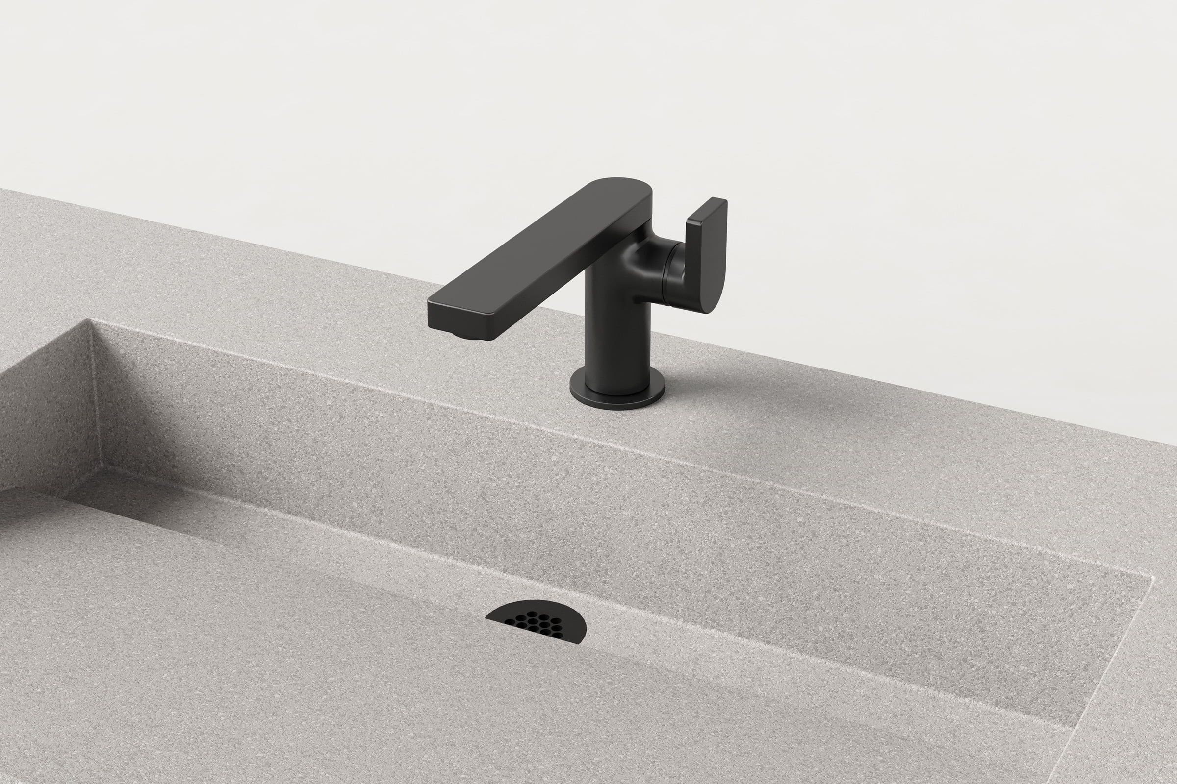 Close-up of black faucet and drain detail on Fog Trof sink.
