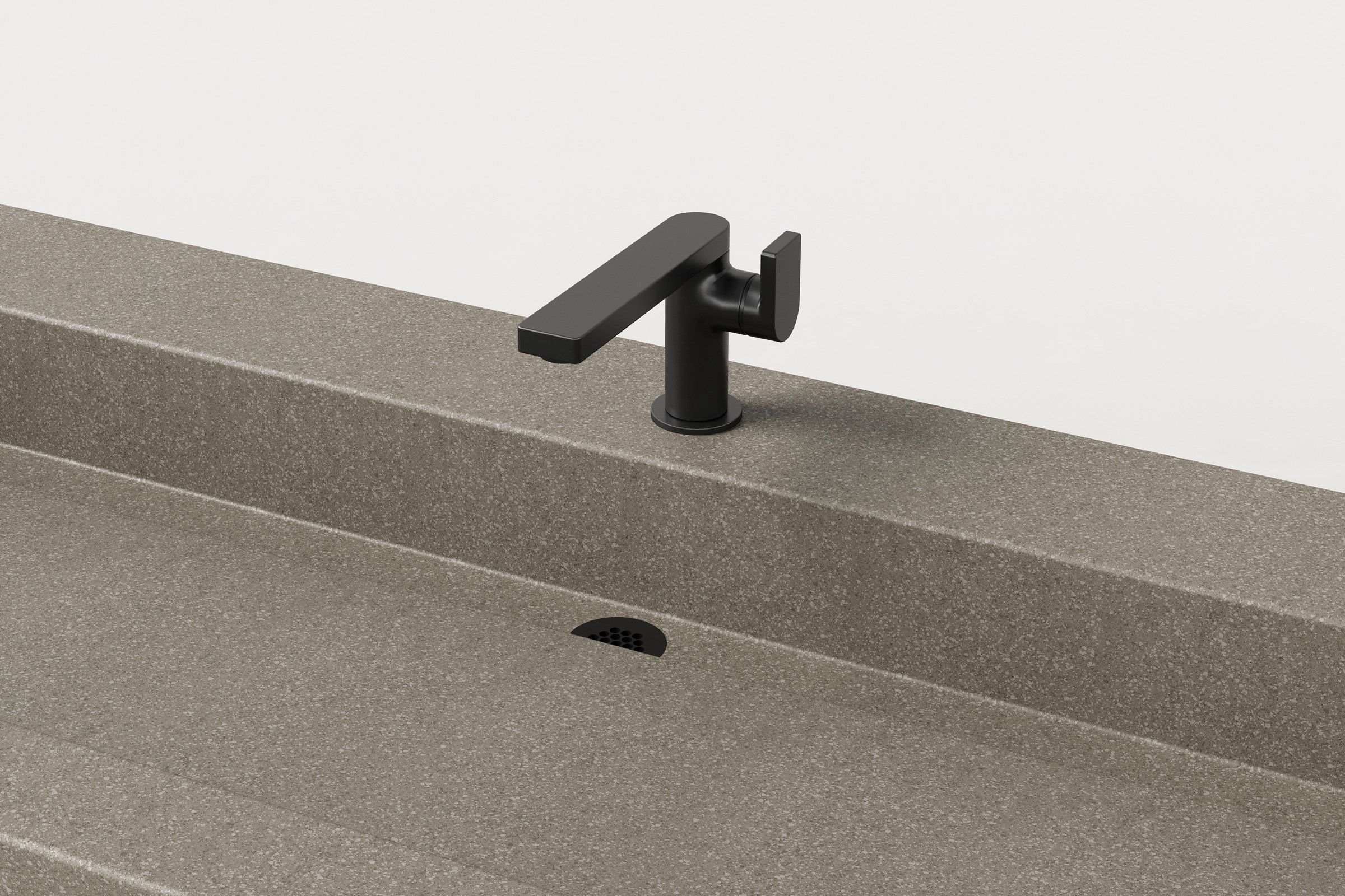 Close-up of matte black faucet and drain detail on Trof Drop 72 sink in Hurricane finish.