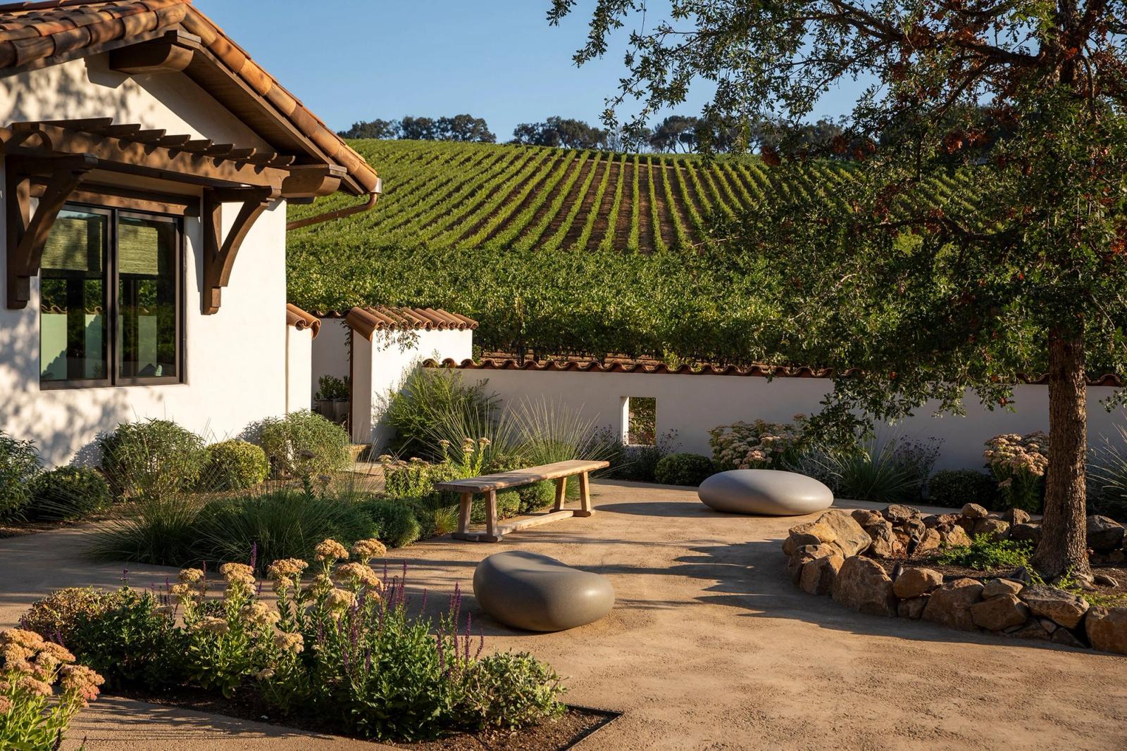 Soma Stones in a backyard with a vineyard view