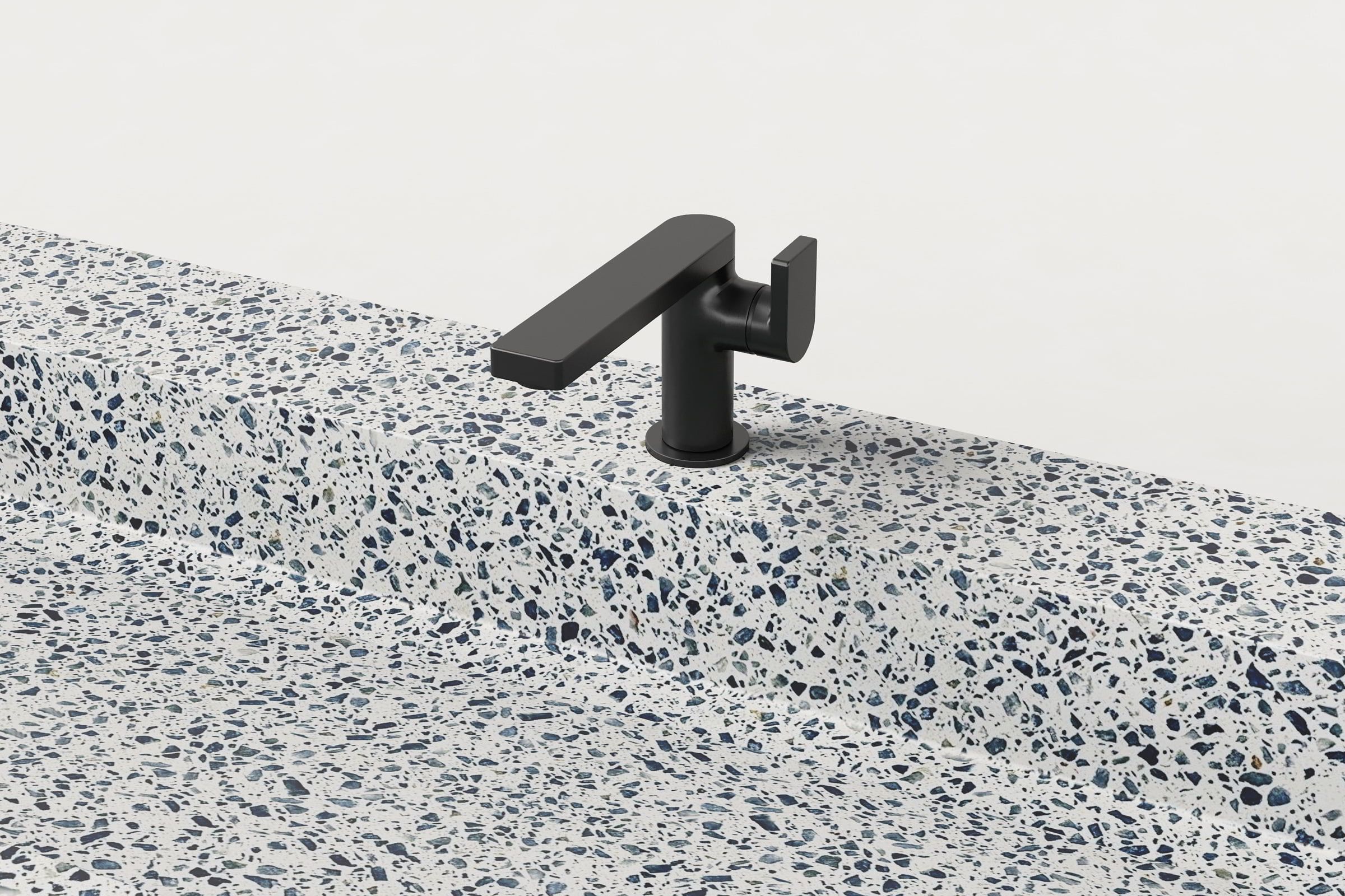 Close-up of matte black faucet on Unazzo Trof sink.