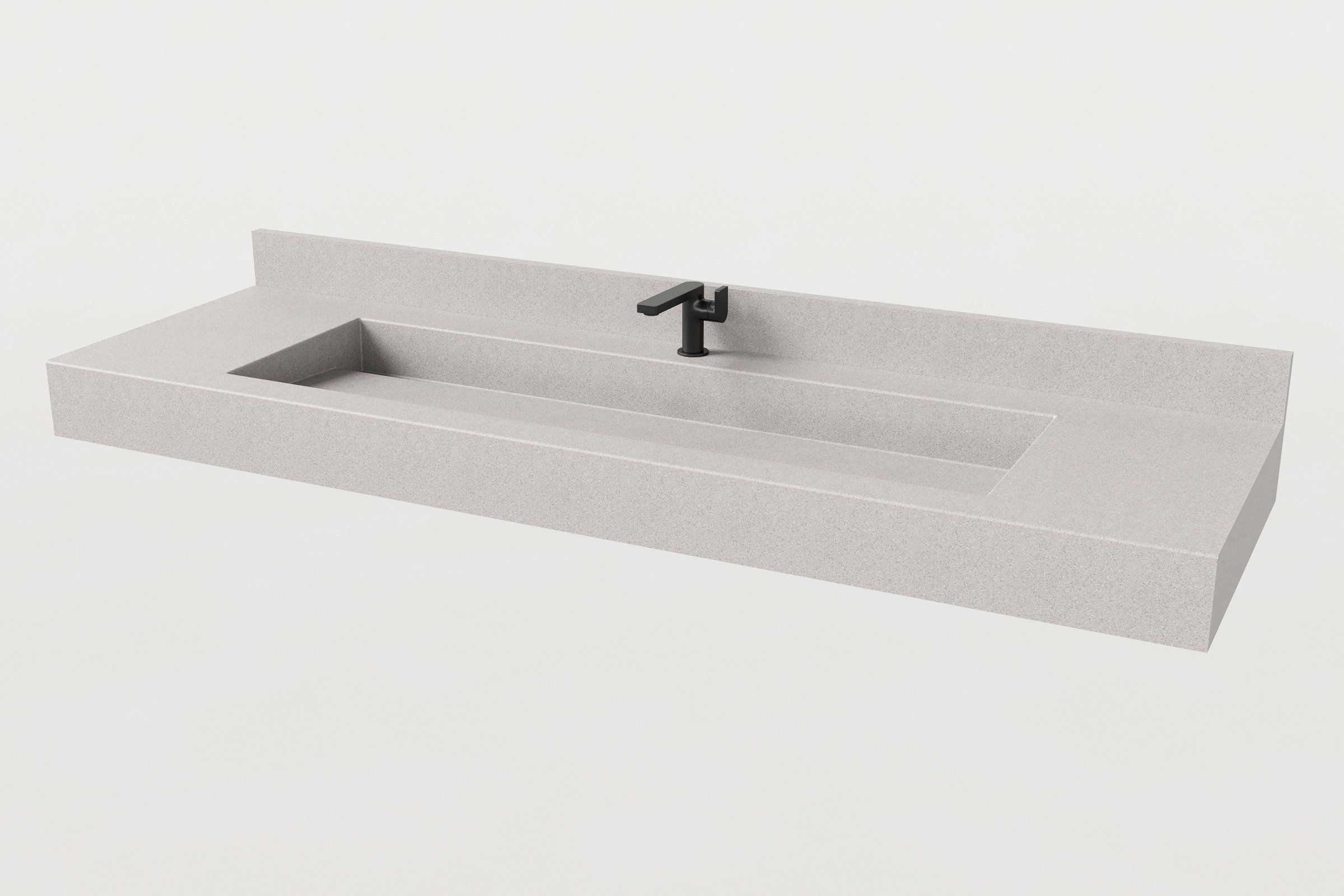Rectangular concrete sink basin in Fog finish with matte black faucet and low backsplash.
