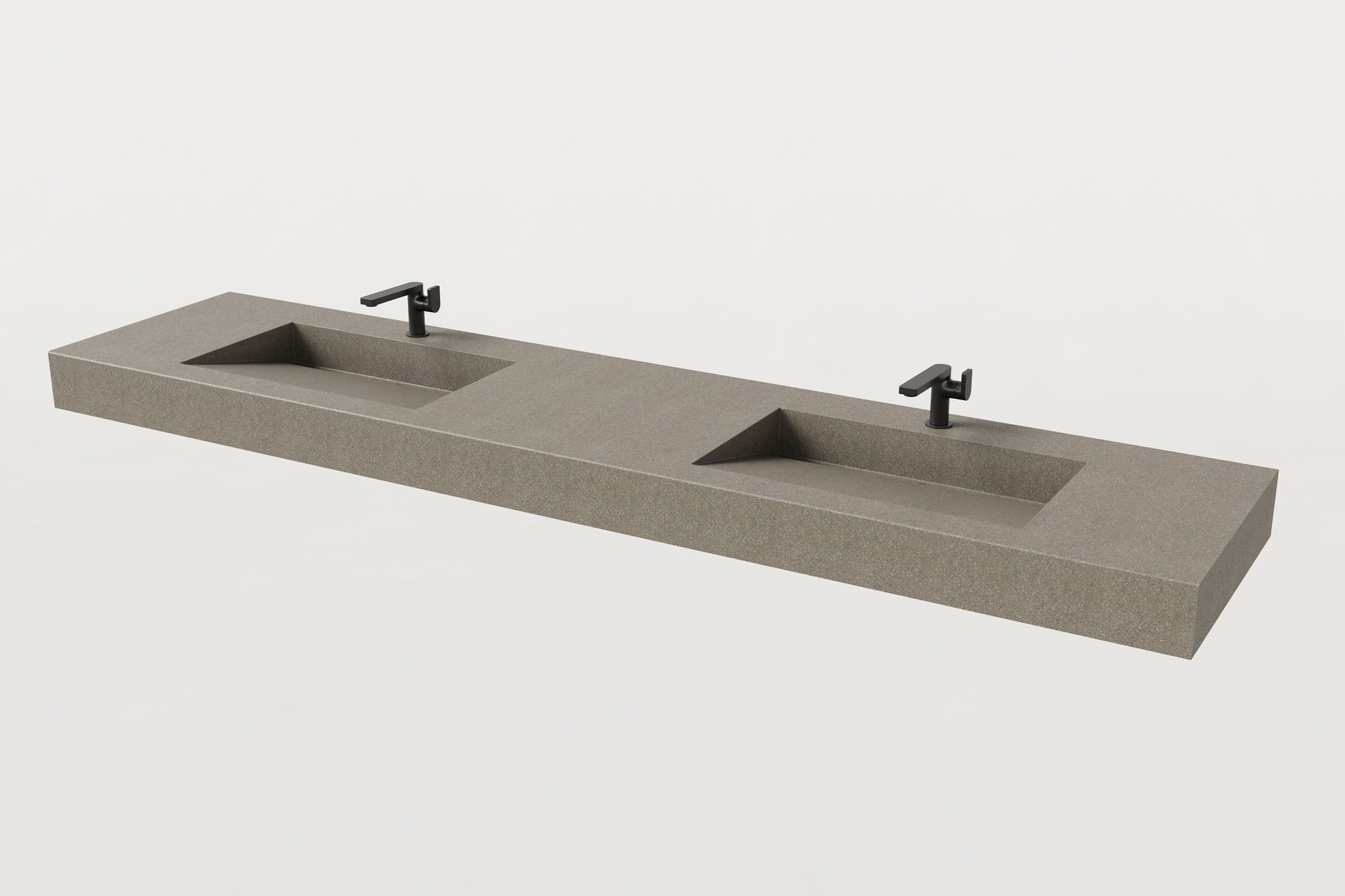 Beige double-basin Trof sink with faucets.