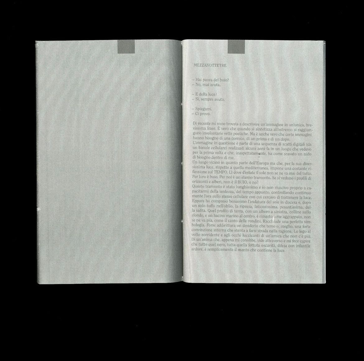 Spread with a printed text in Italian