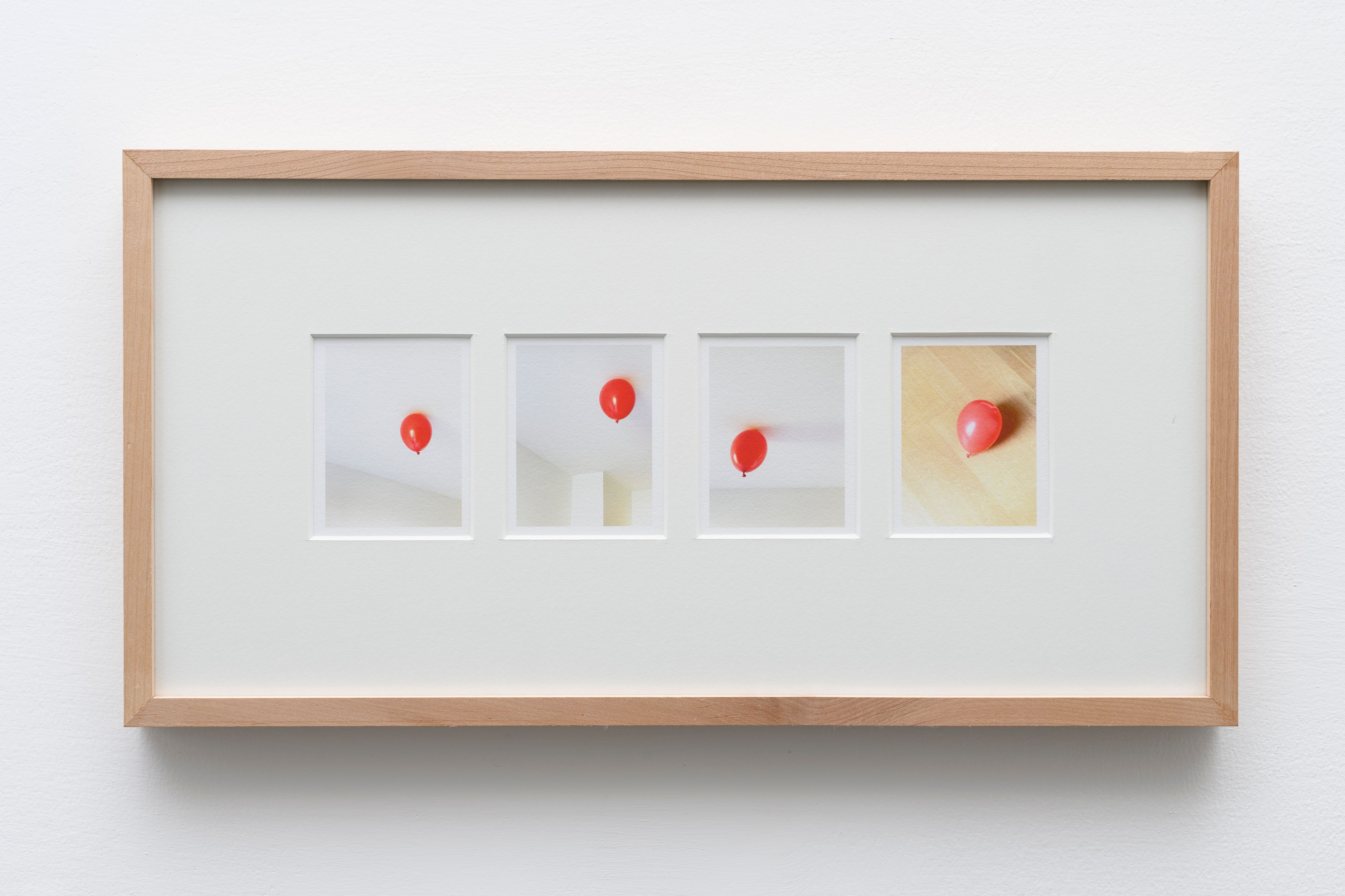 Framed sequence of four photos of a red balloon stuck to a ceiling