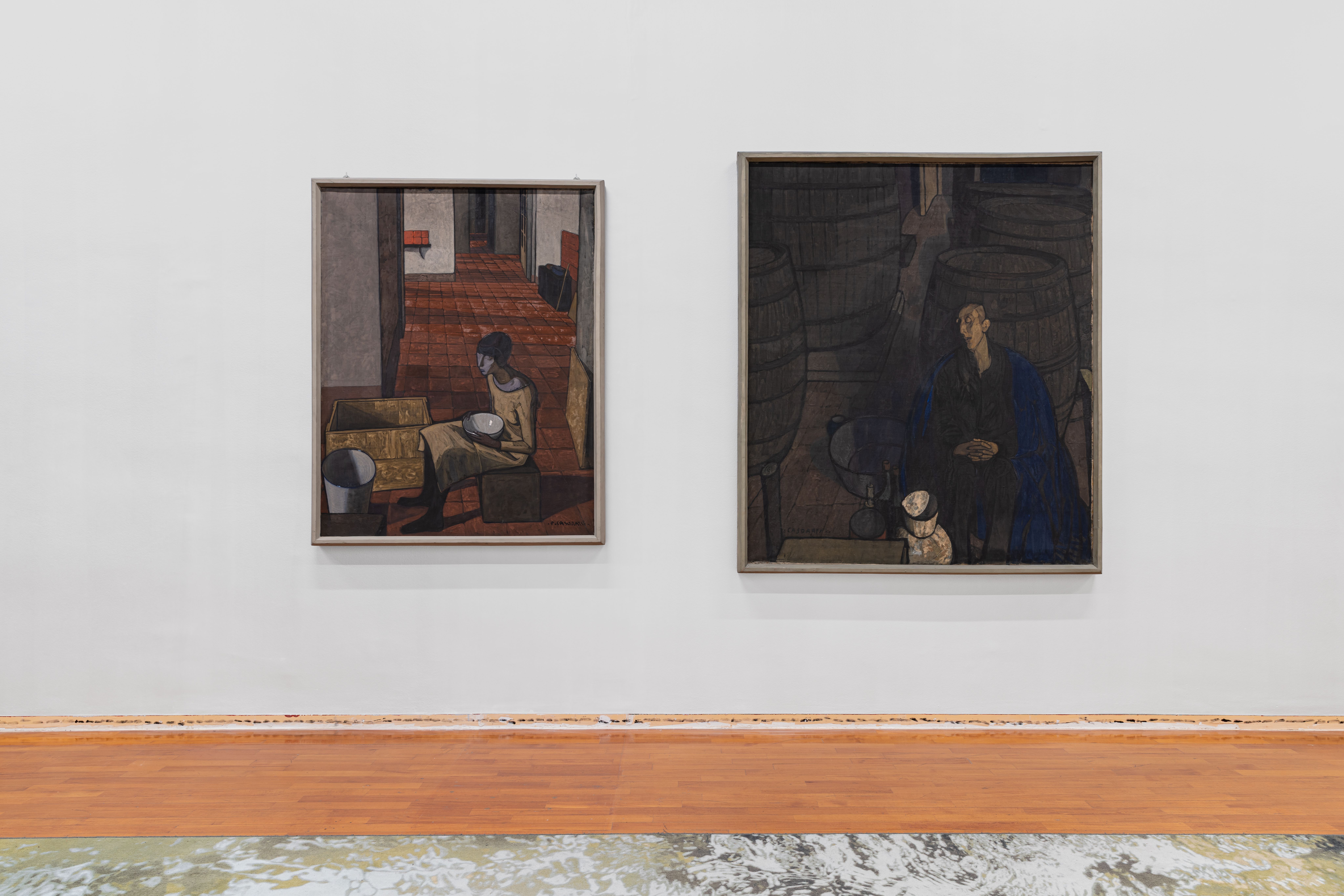 Two paintings on a grey wall, a band of small black stars printed along the skirting