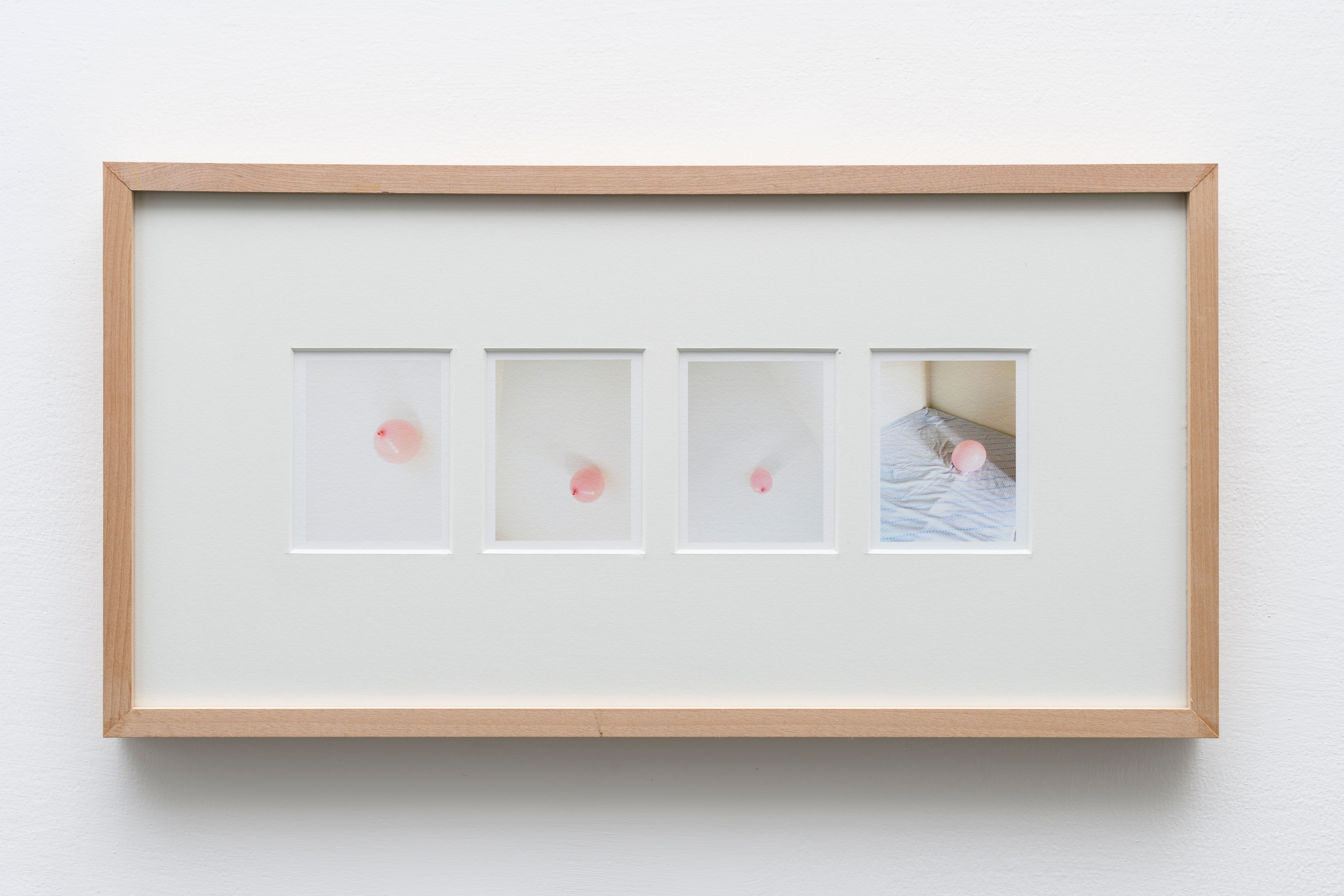 Framed sequence of four photos of a pink balloon, the last one fallen on a bed