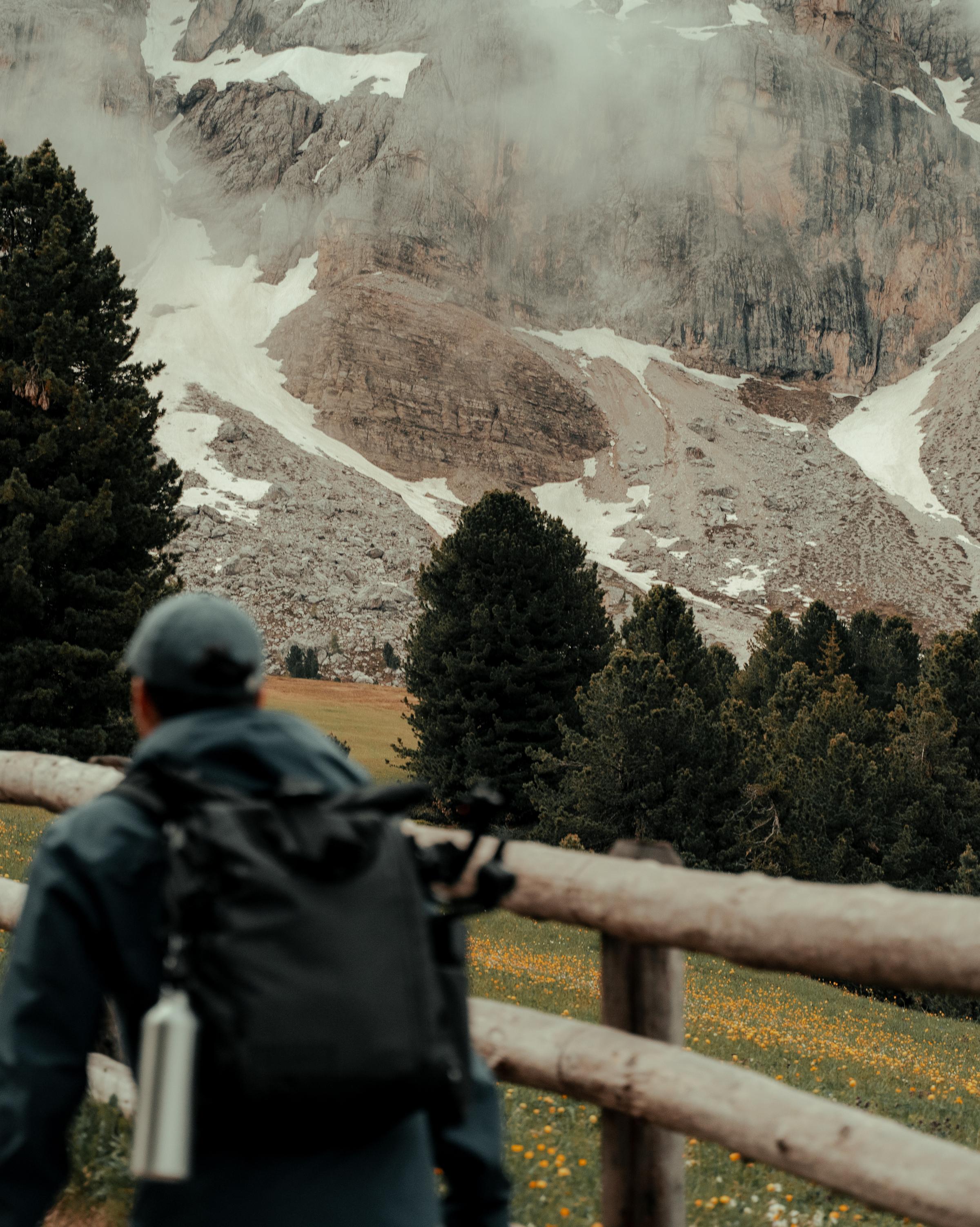 Leader walking on a mountain, representing personal growth and transformational leadership.