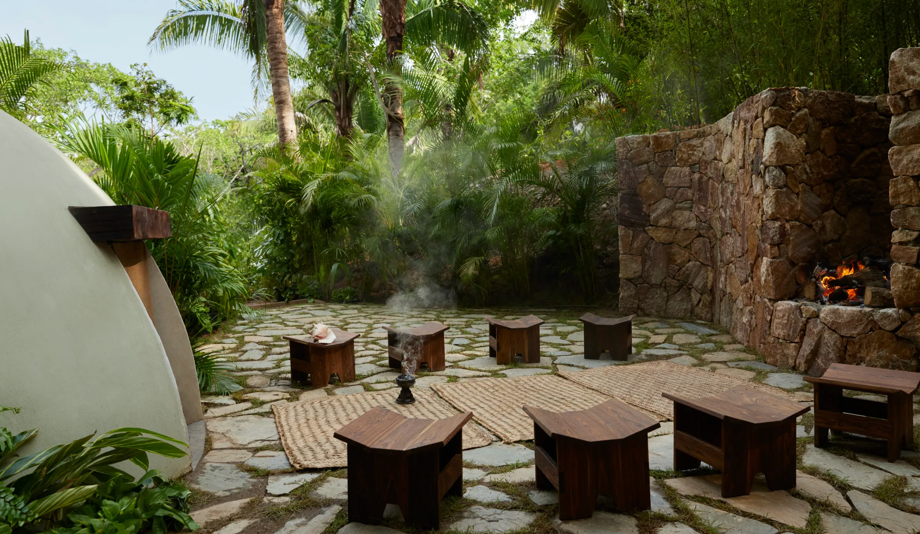 A beautifully designed space featuring elegant furnishings, natural textures, and locally inspired decor, creating a harmonious blend of luxury and comfort.