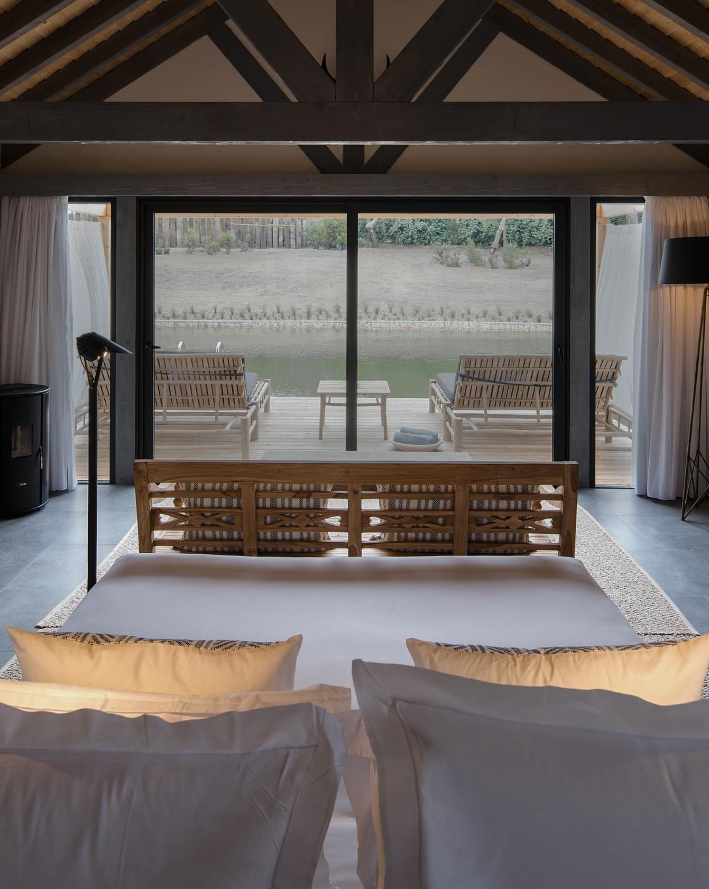 Sublime Comporta's tranquil pool surrounded by lush greenery and soothing coastal scenery.