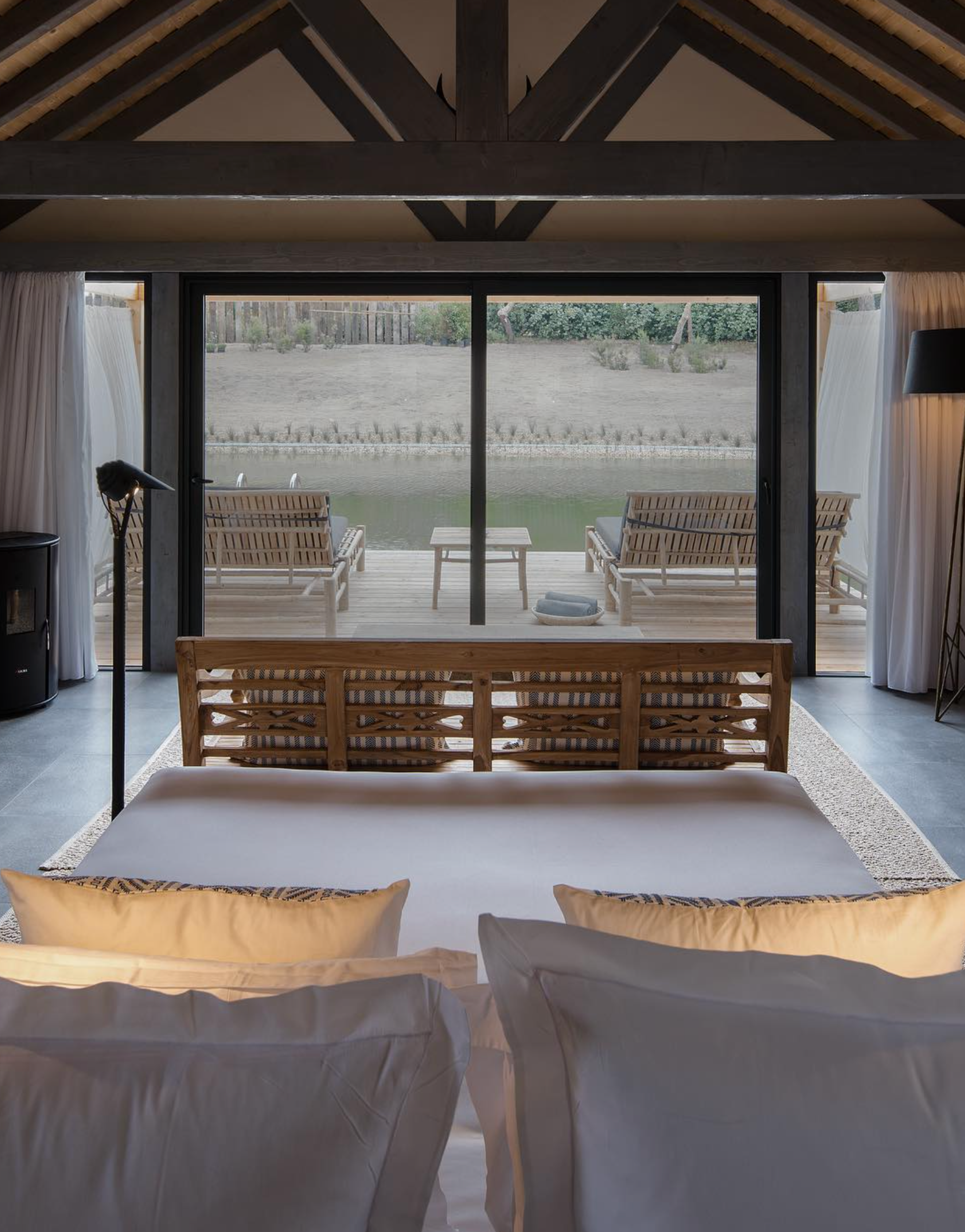 Sublime Comporta's tranquil pool surrounded by lush greenery and soothing coastal scenery.