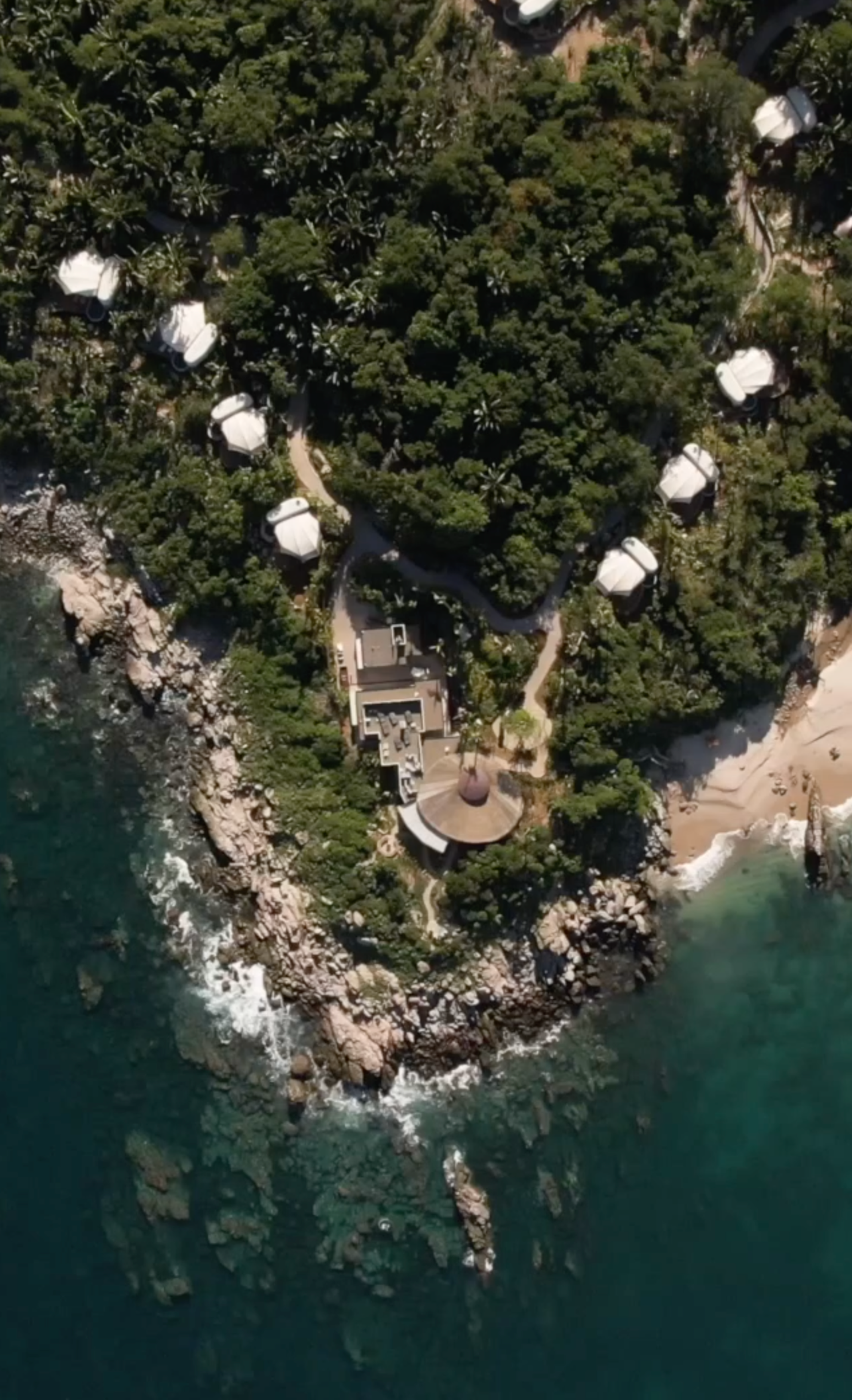 Lush Jungle View: A serene luxury tent nestled amidst the vibrant greenery of Punta Mita's lush jungle.