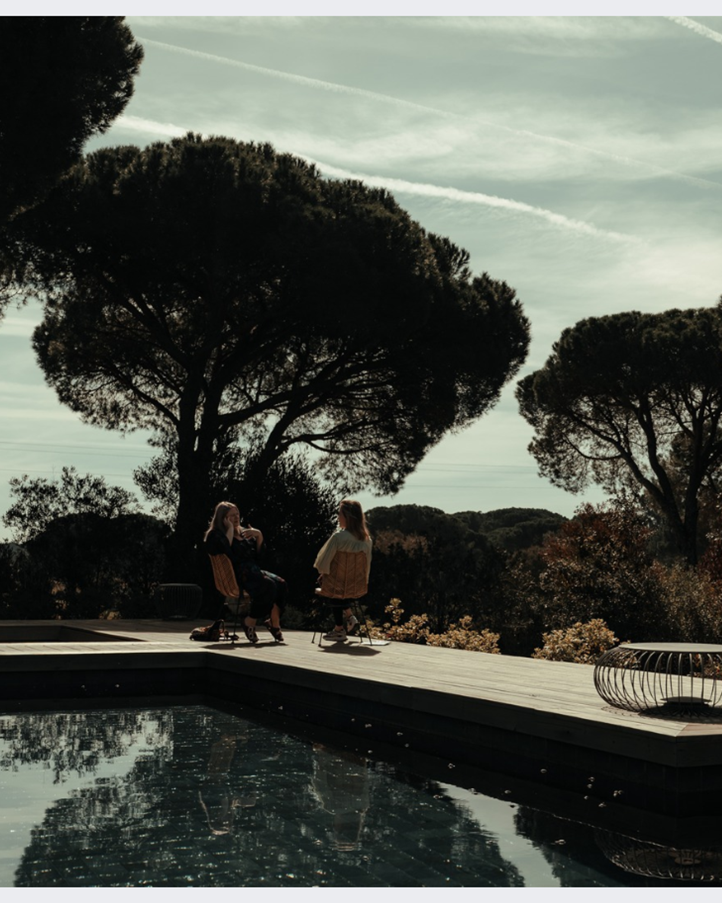 A serene meditation class in progress, with participants seated in a circle, focusing on mindfulness and relaxation in a tranquil environment.