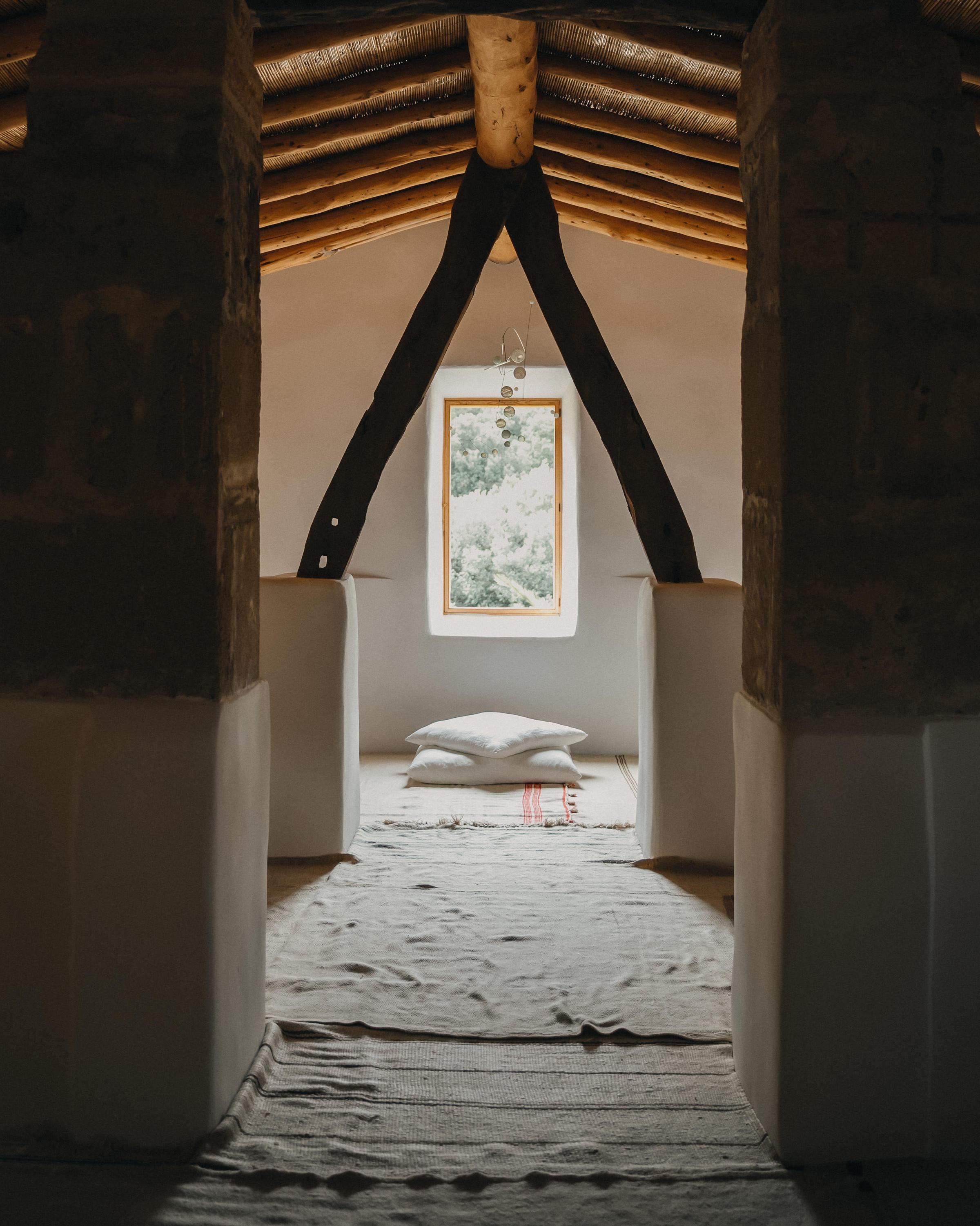 In the serene yoga room at Es Racó d'Artà, guests are welcomed into a space thoughtfully designed for exclusive experiences and lasting memories