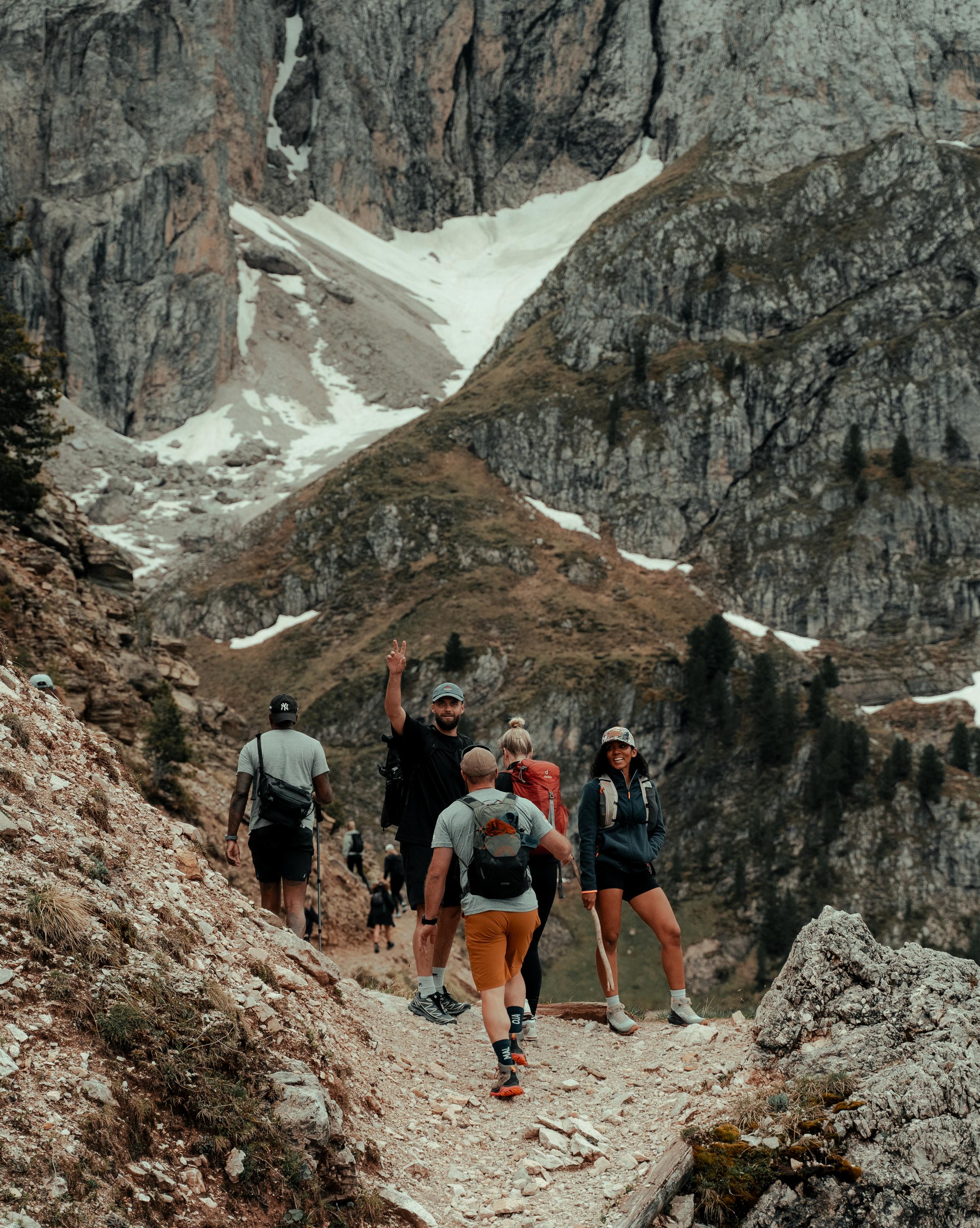 Group hiking session in the stunning Dolomites during the Mountain Mastery retreat, fostering resilience and connection.