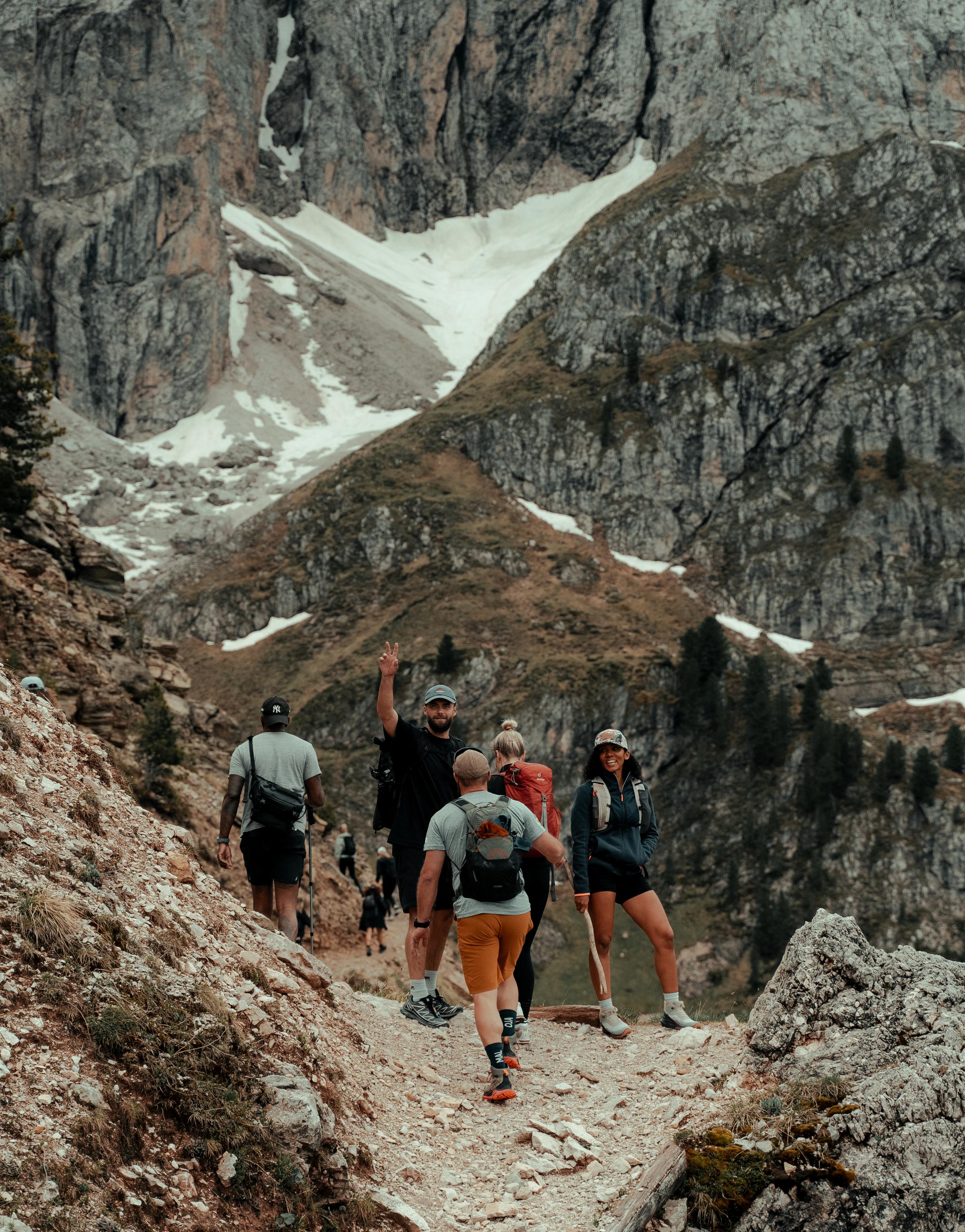 Group hiking session in the stunning Dolomites during the Mountain Mastery retreat, fostering resilience and connection.