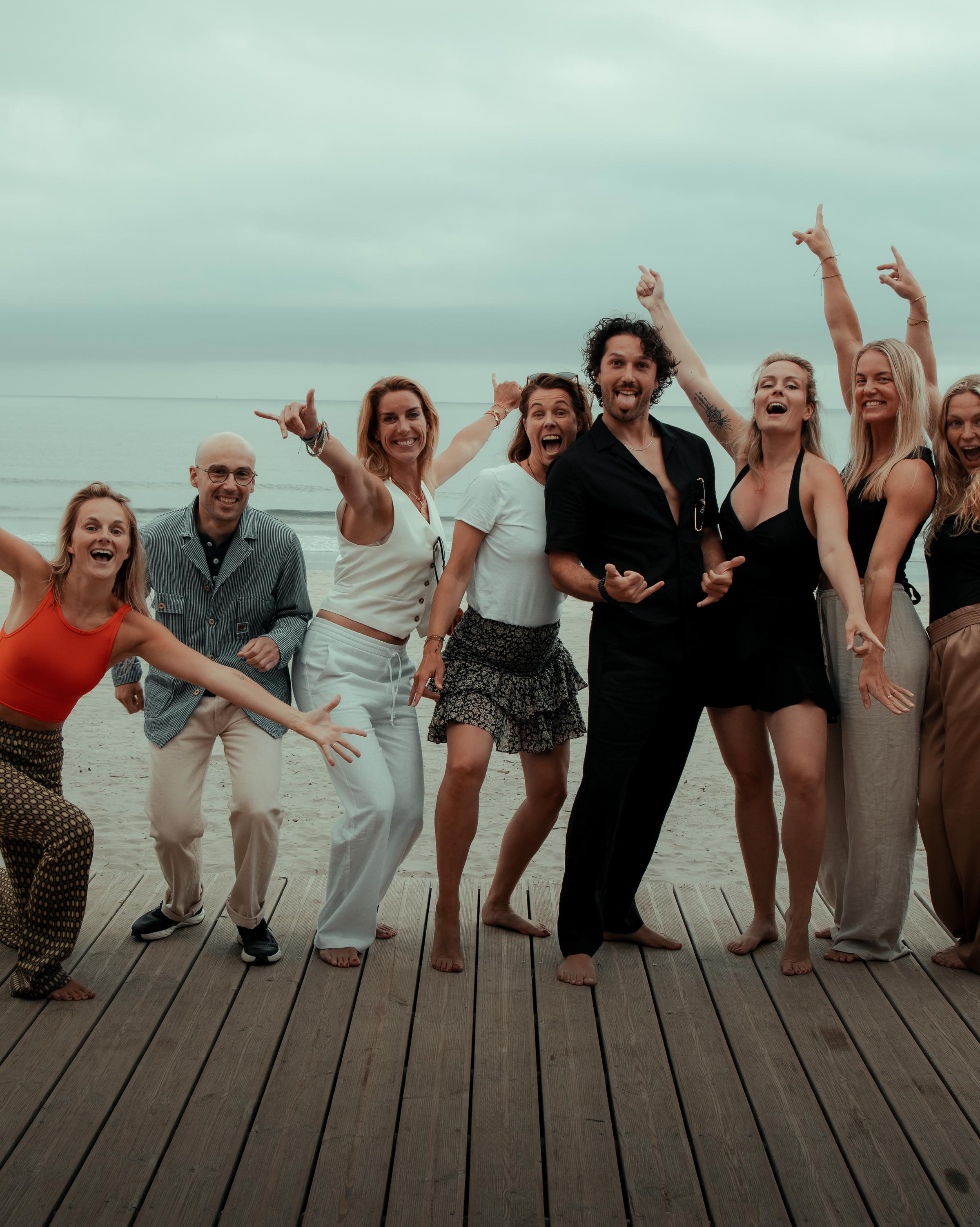 Surfer riding a wave at sunset in Portugal, symbolizing flow state, presence, and emotional release through ocean immersion and movement.