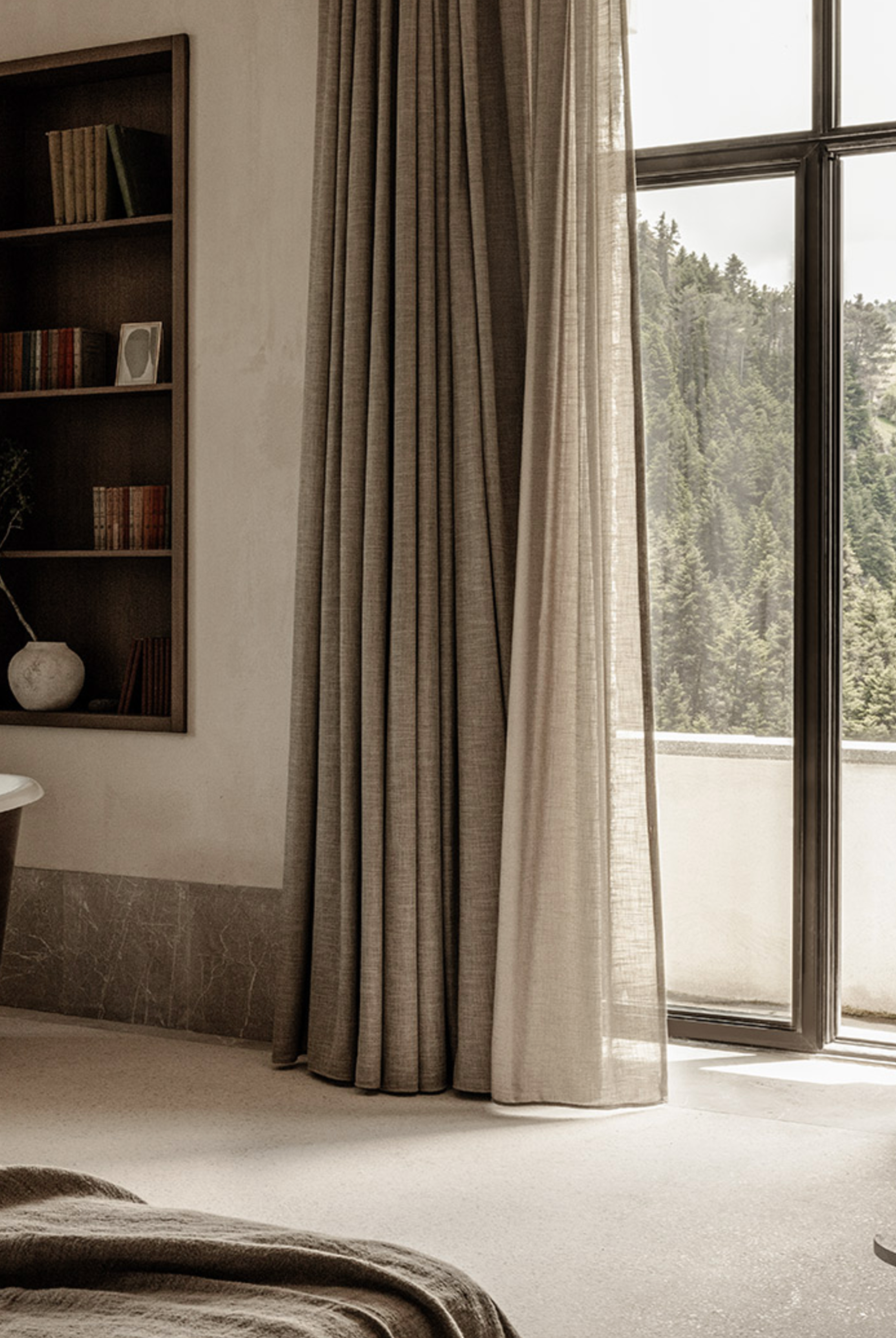 MANNA Suite offering generous space, stylish comfort, and panoramic views of the surrounding evergreen forests.