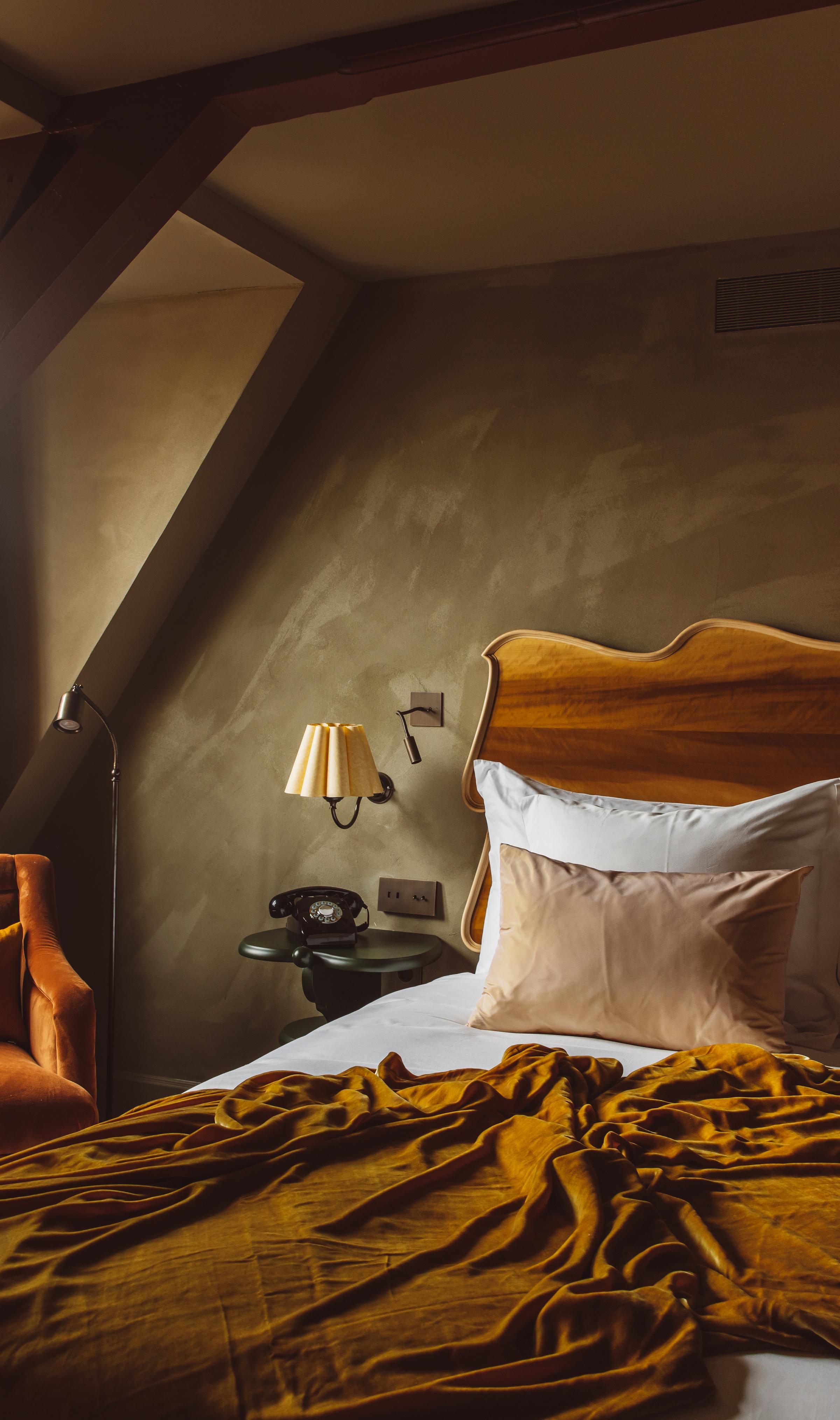 Unwind Dutch-style: soft velvet throws, bespoke ceramics, and serene lake views make every room at The Durgerdam your personal haven.