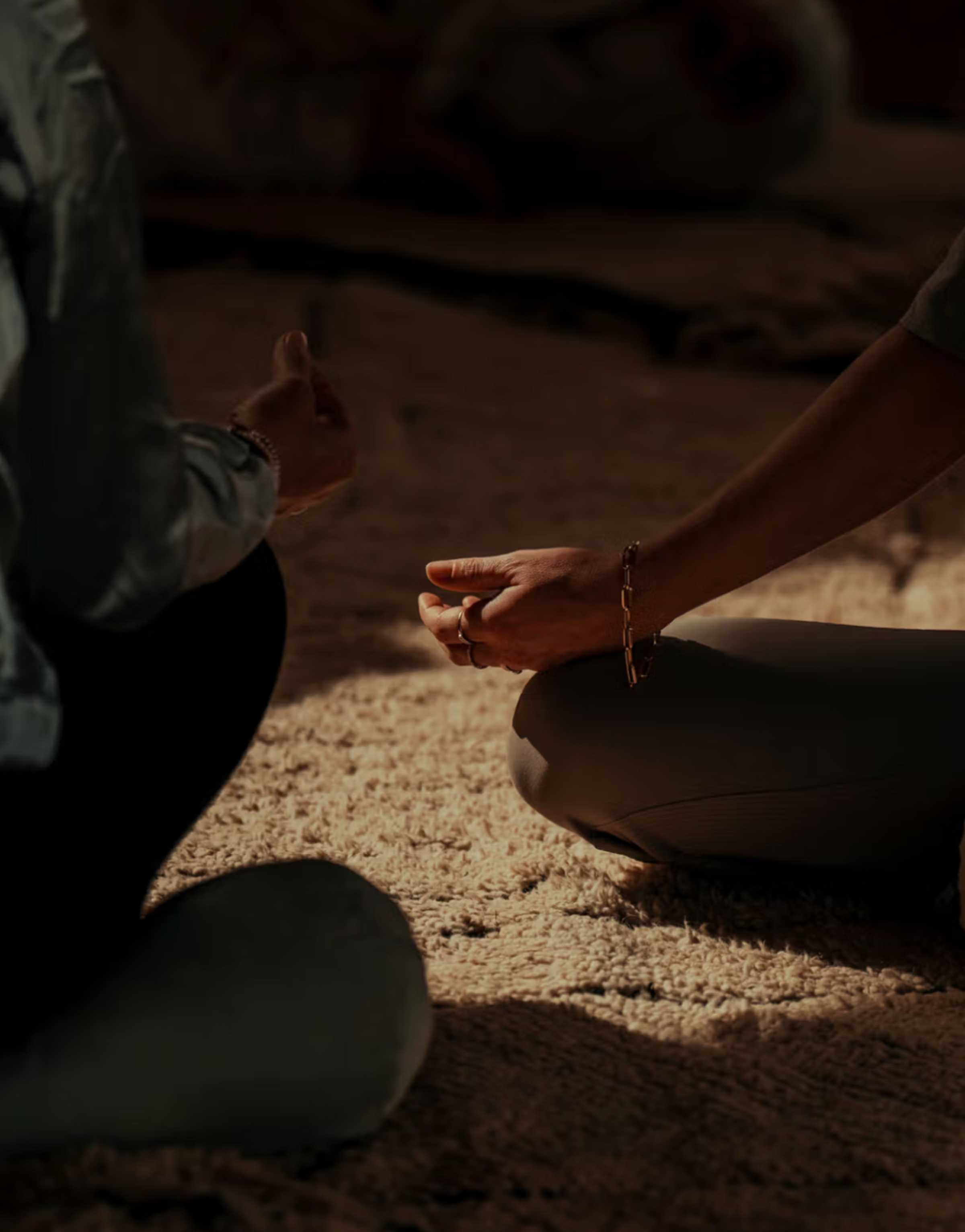 Person meditating in a serene natural setting, embracing stillness and inner peace.