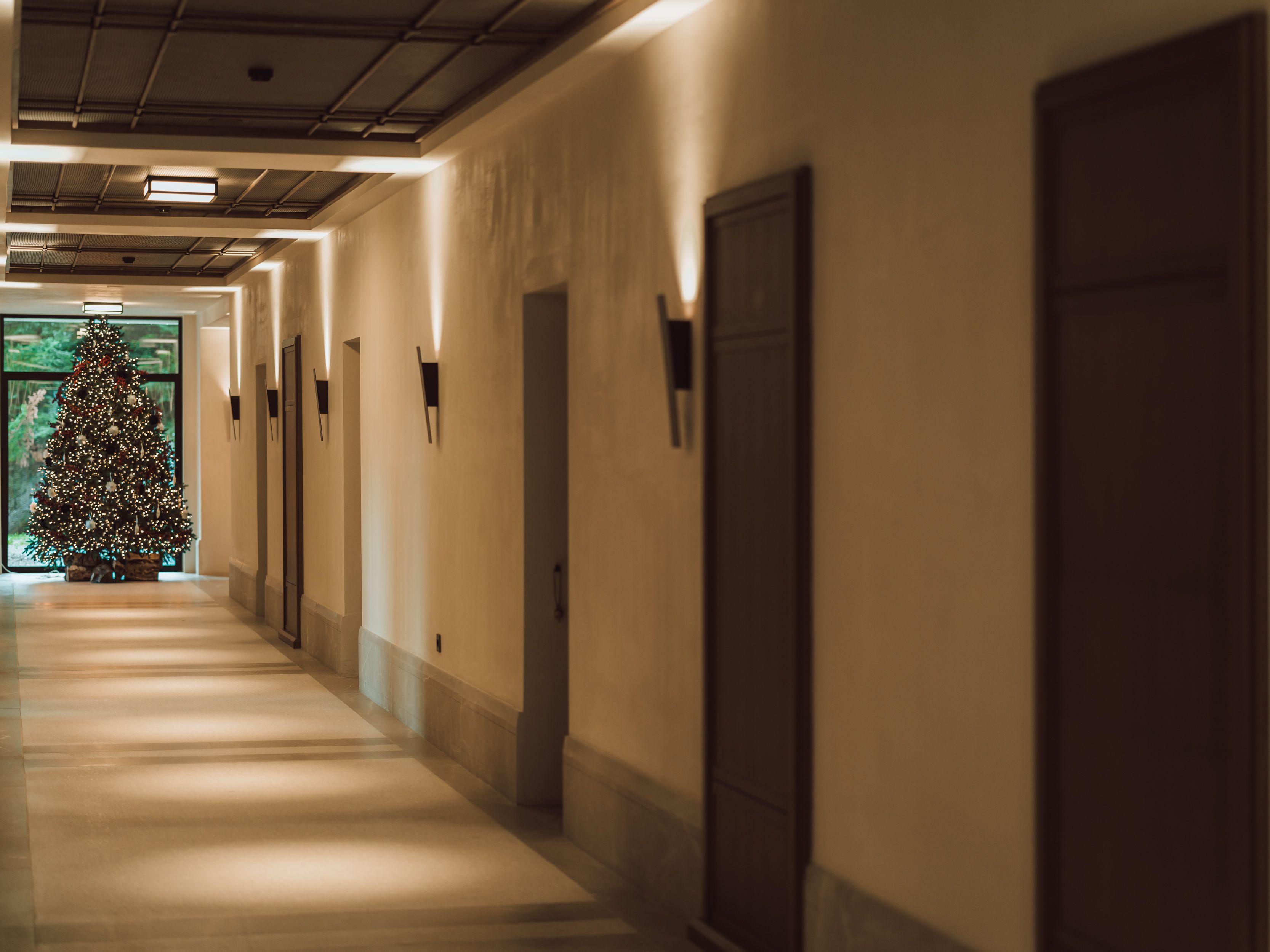 Warm, inviting lounge area at MANNA featuring cozy seating and authentic Greek design details.