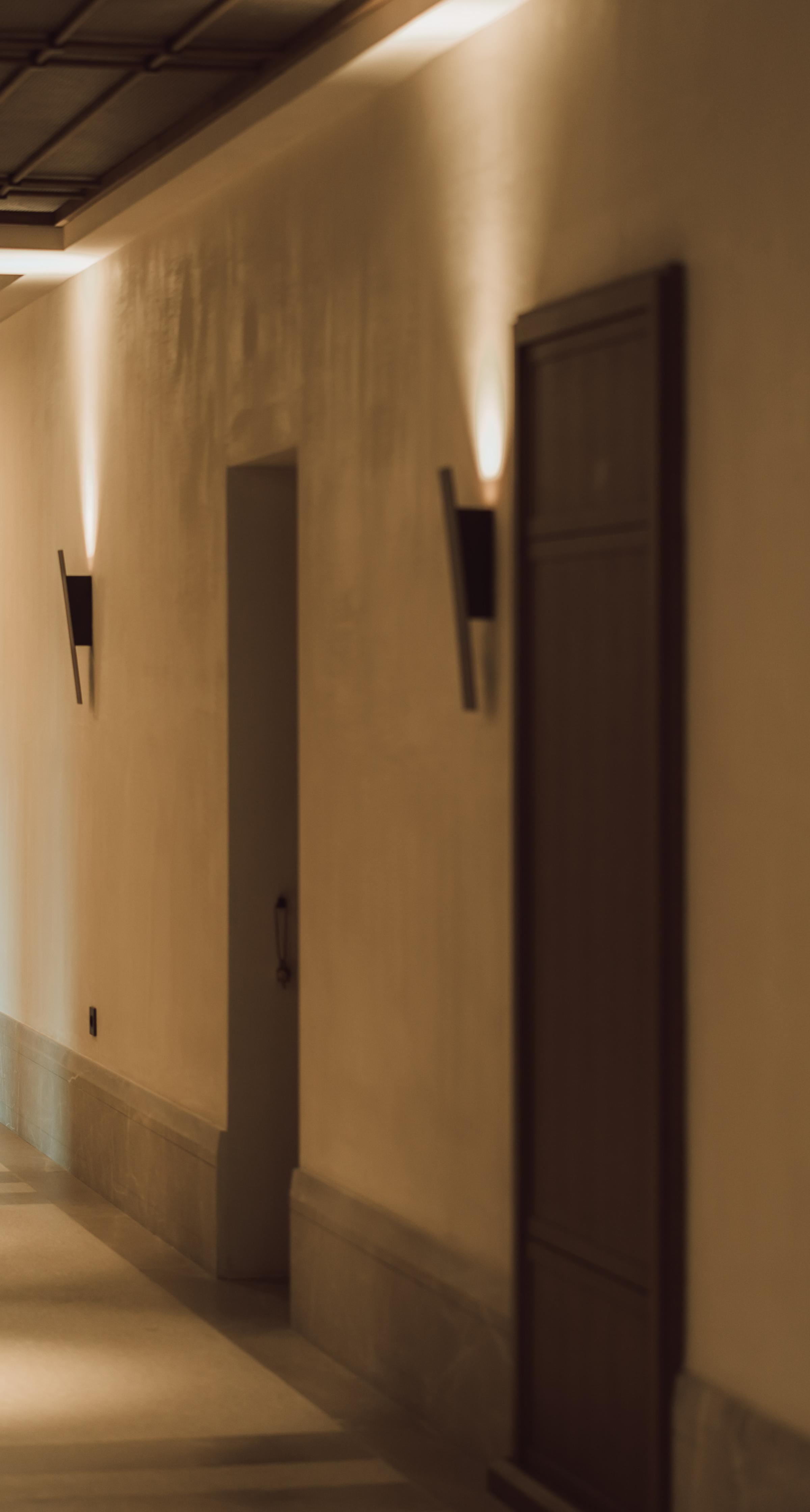 Warm, inviting lounge area at MANNA featuring cozy seating and authentic Greek design details.