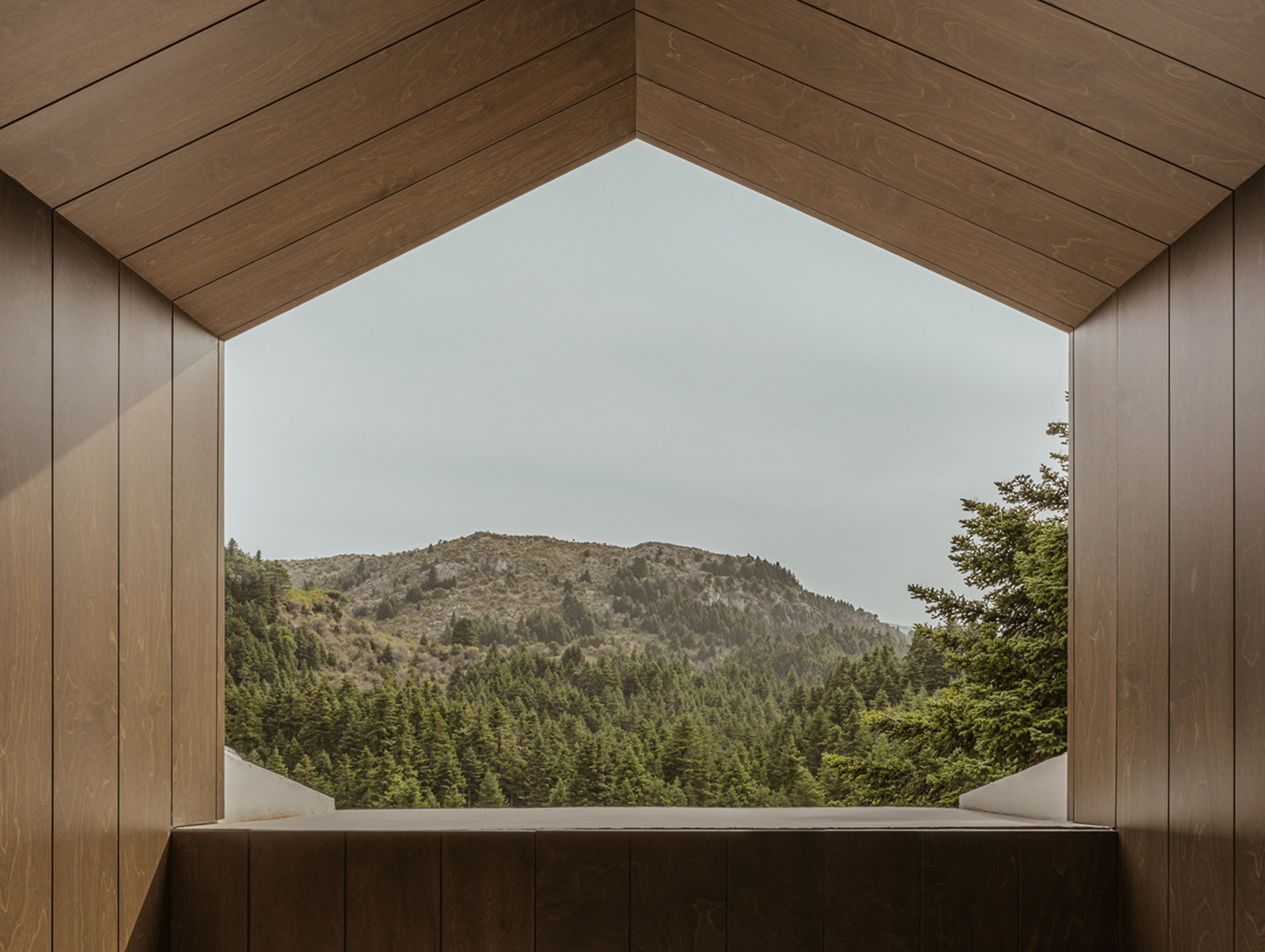 Inviting interior of the MANNA Suite, featuring premium comfort, sophisticated décor, and calming mountain vistas.