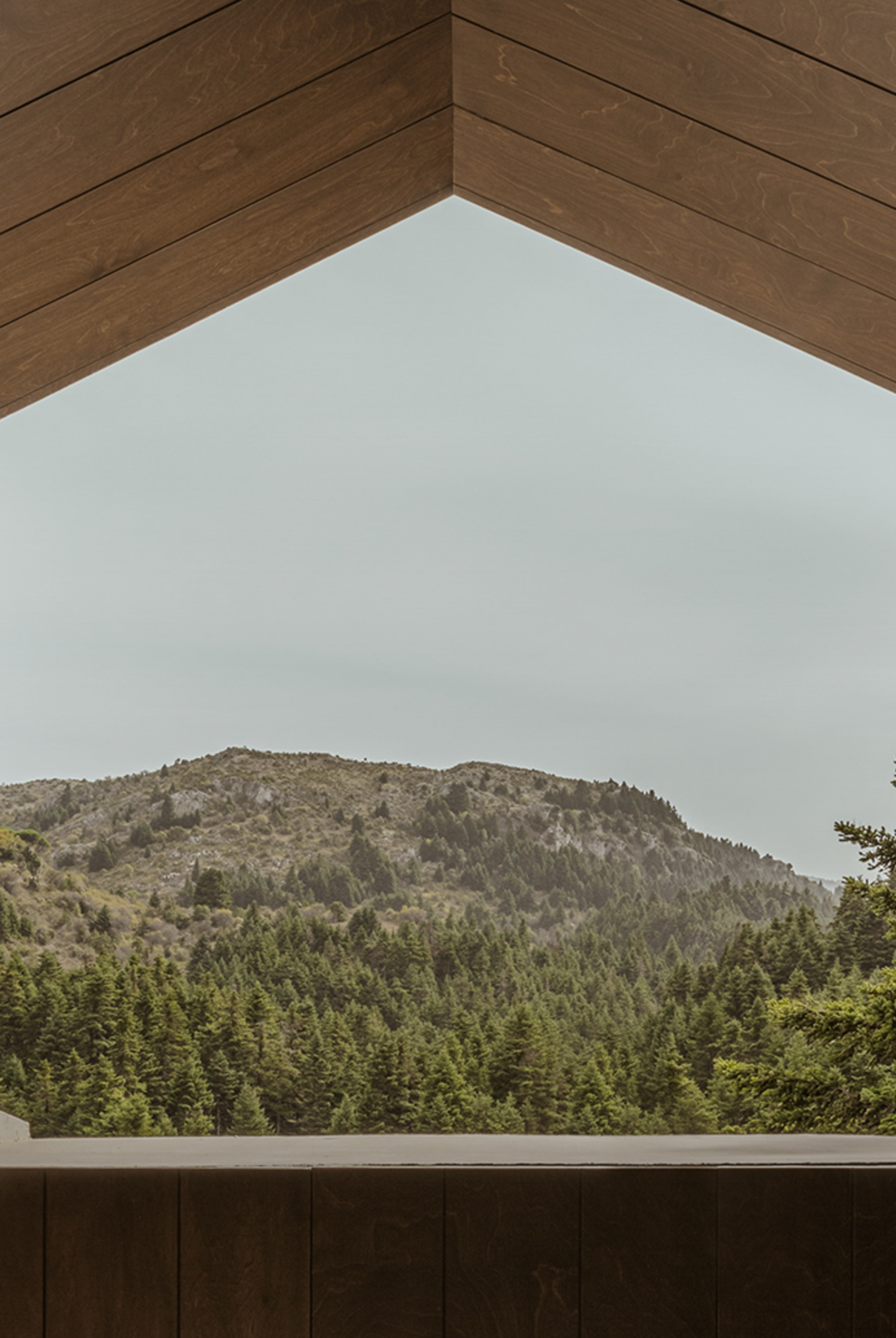 Inviting interior of the MANNA Suite, featuring premium comfort, sophisticated décor, and calming mountain vistas.
