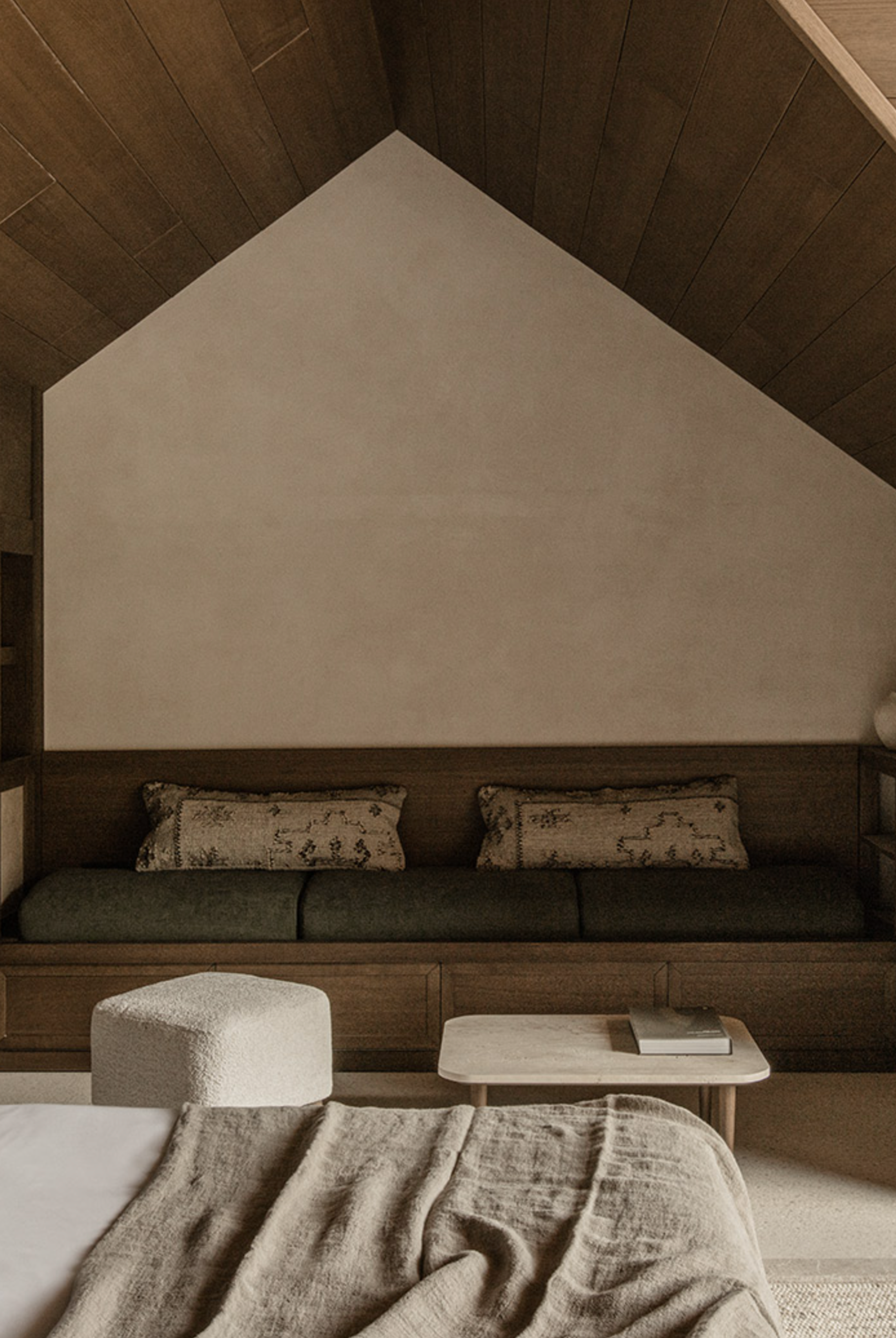 Warm and inviting Junior Suite at MANNA with elegant furnishings, plush bedding, and tranquil mountain surroundings.