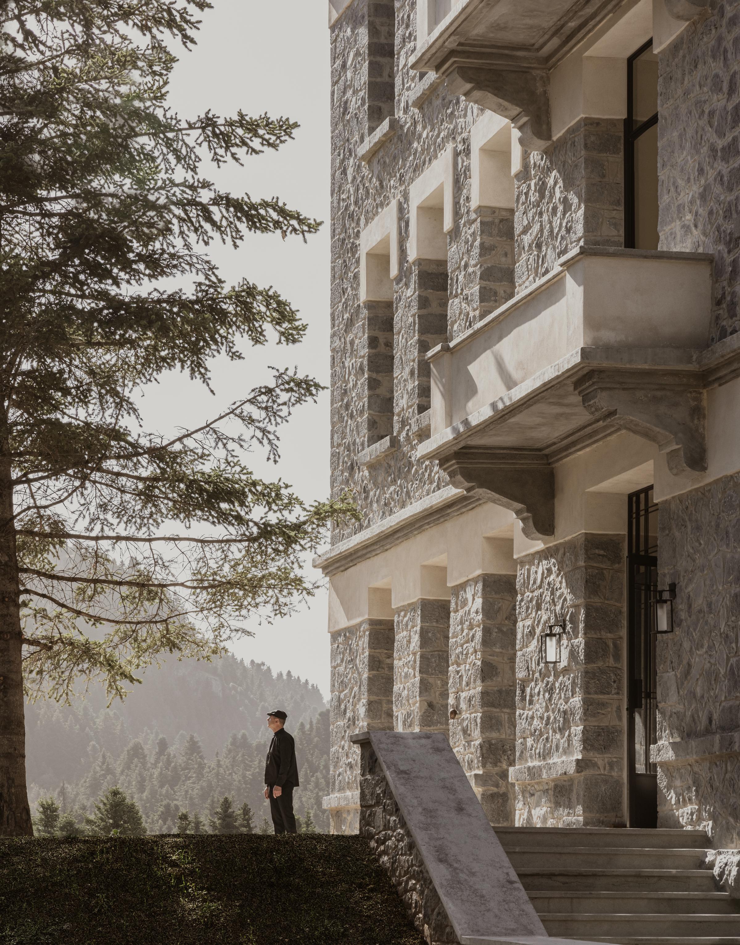 Tranquil forest landscape surrounding MANNA retreat, with mist rolling through the fir trees in Arcadia, Greece